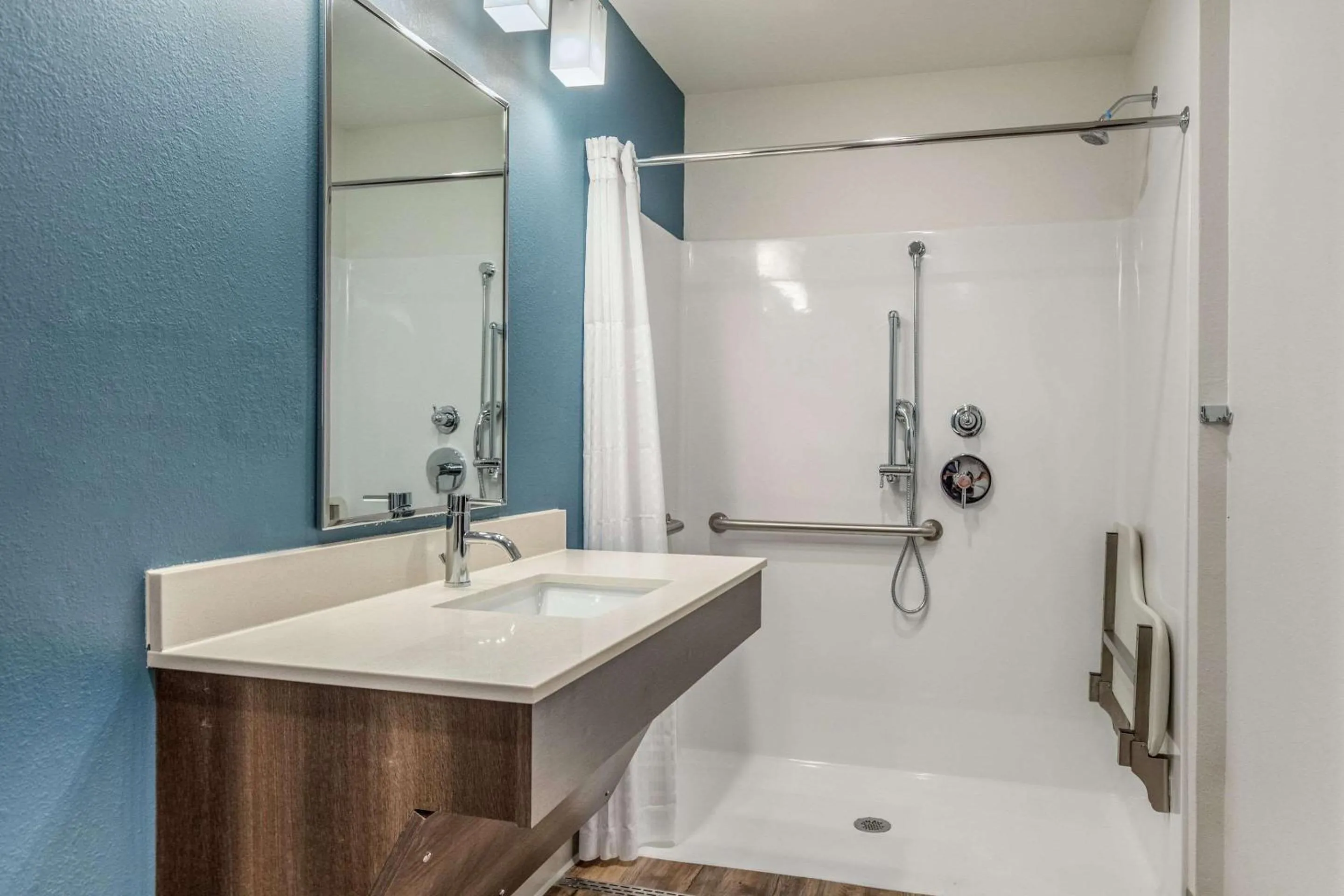 Bathroom in WoodSpring Suites Greenville Haywood Mall