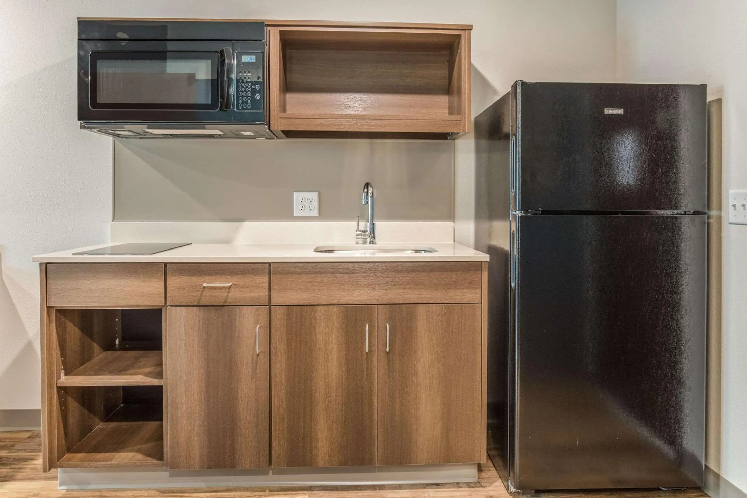 Photo of the whole room in WoodSpring Suites Greenville Haywood Mall