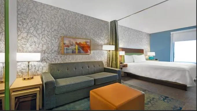 Seating area, Bed in Home2 Suites By Hilton Utica, Ny
