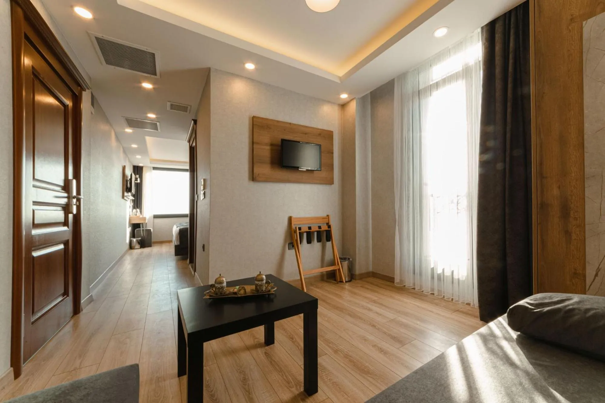 Living room, Bed in World Heritage Center Hotel