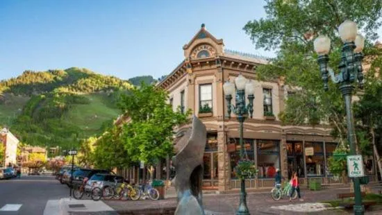 Property building in Luxury 2 Bedroom Downtown Aspen Vacation Rental With Access To A Heated Pool, Hot Tubs, Game Room And Spa