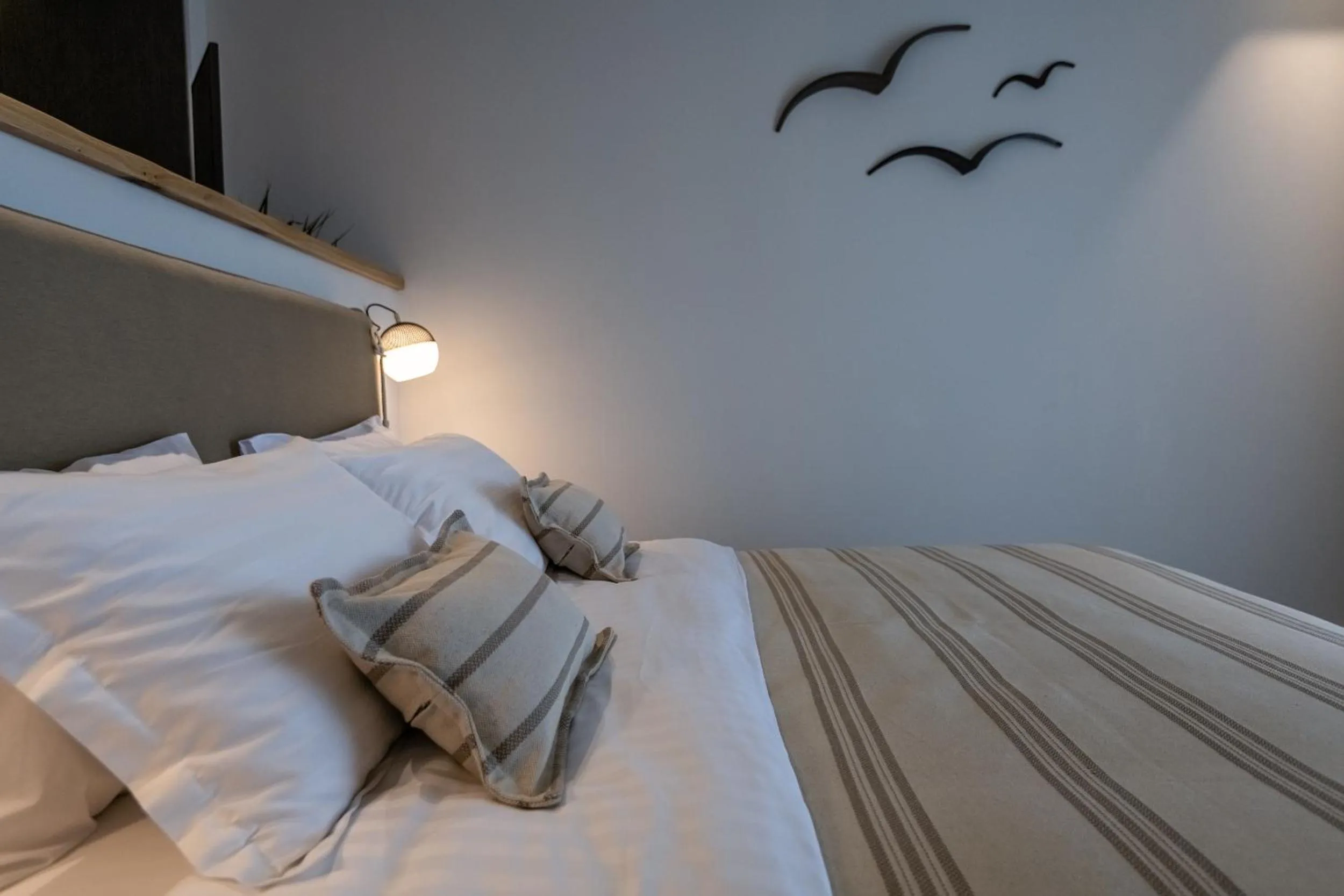 Bed in NISSEA Boutique Hotel