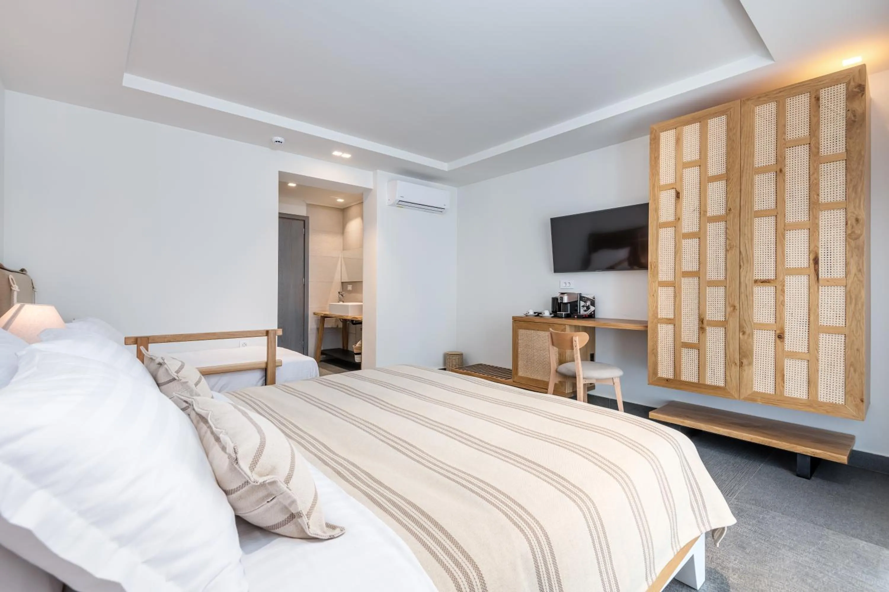 Bed in NISSEA Boutique Hotel