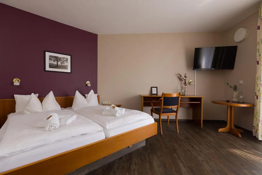 Photo of the whole room, Bed in Landgasthaus Gieseke-Asshorn