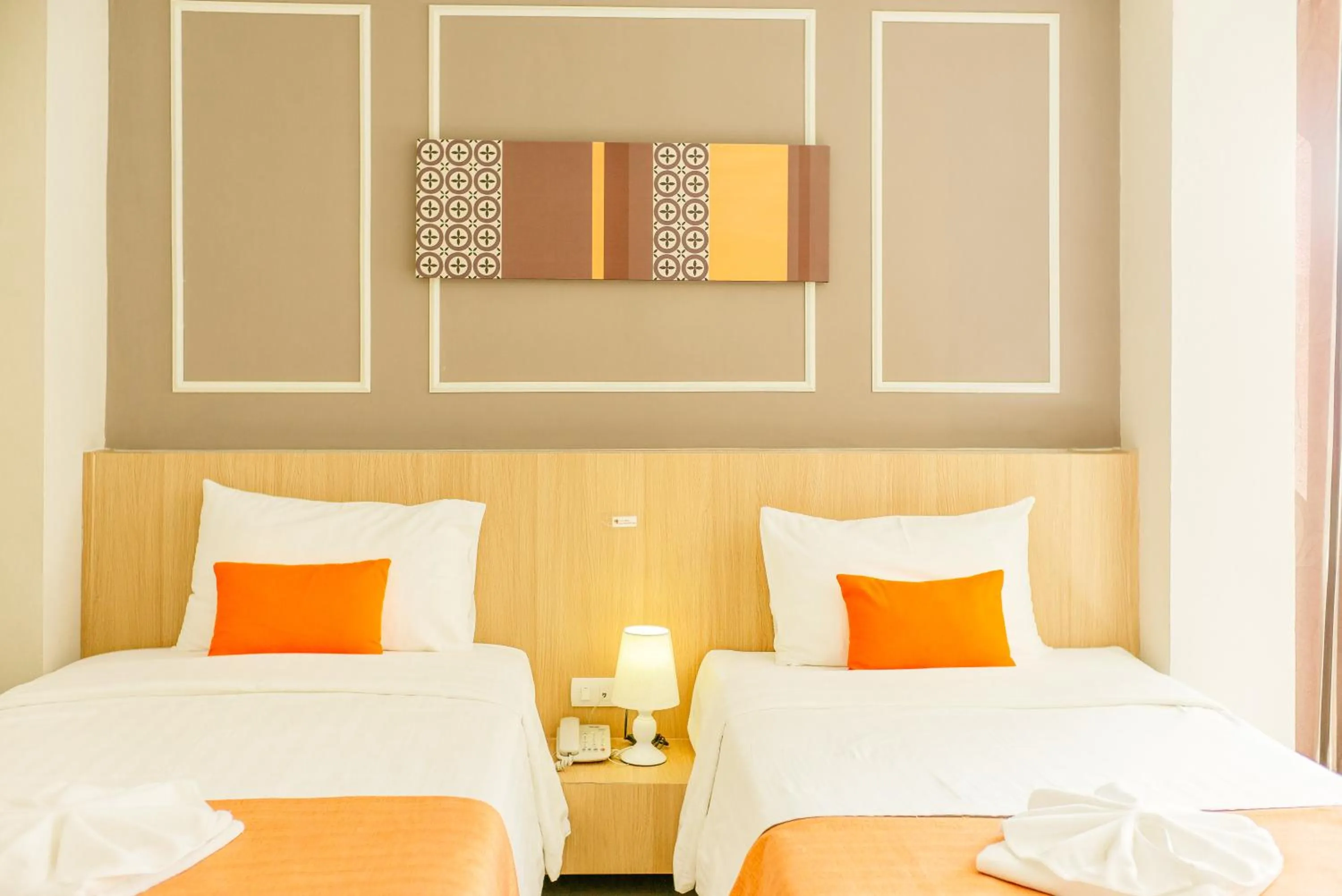 Bed in De Hug Hotel & Residence