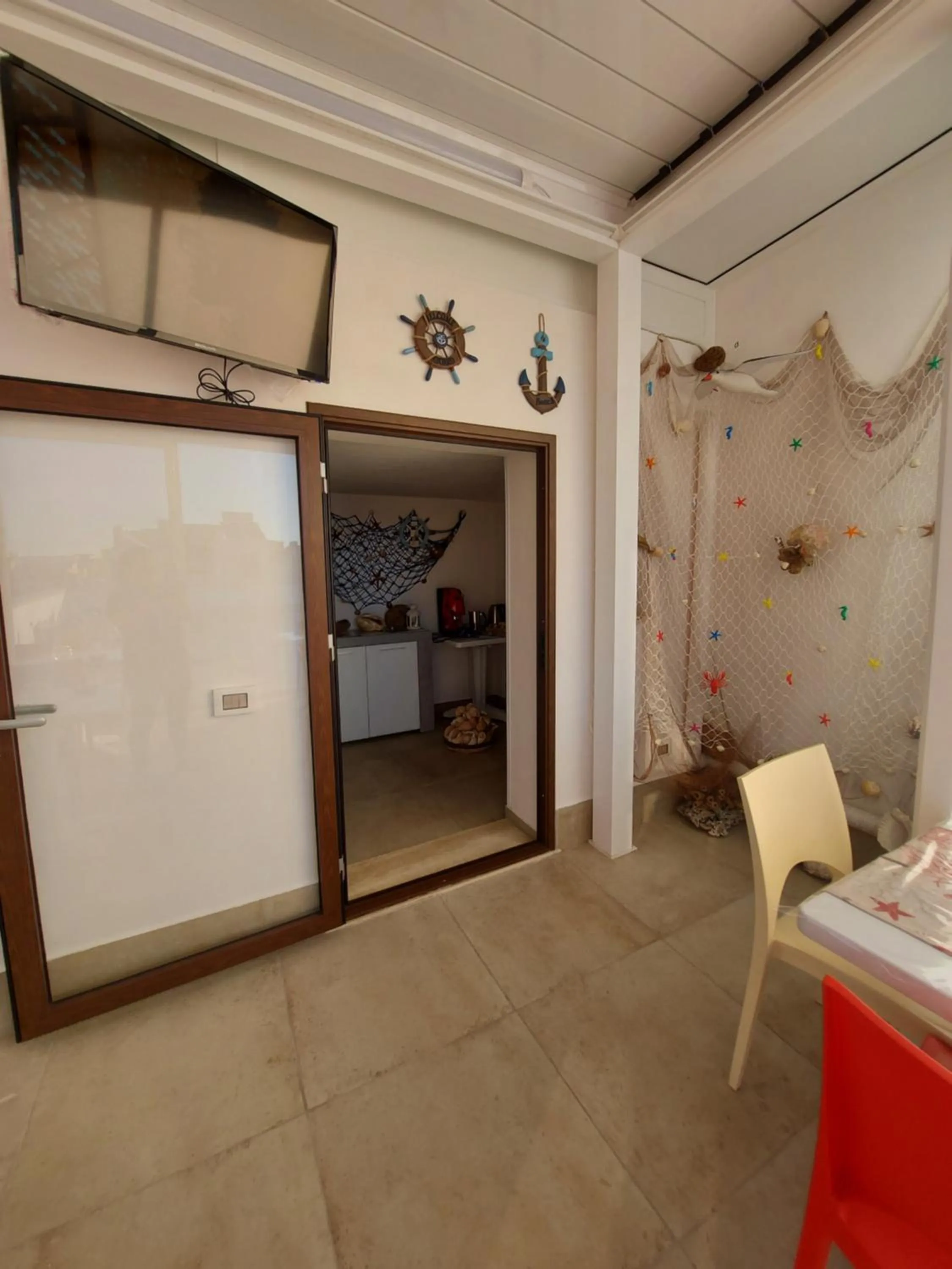 Communal lounge/ TV room in B&B La Casa di Pino