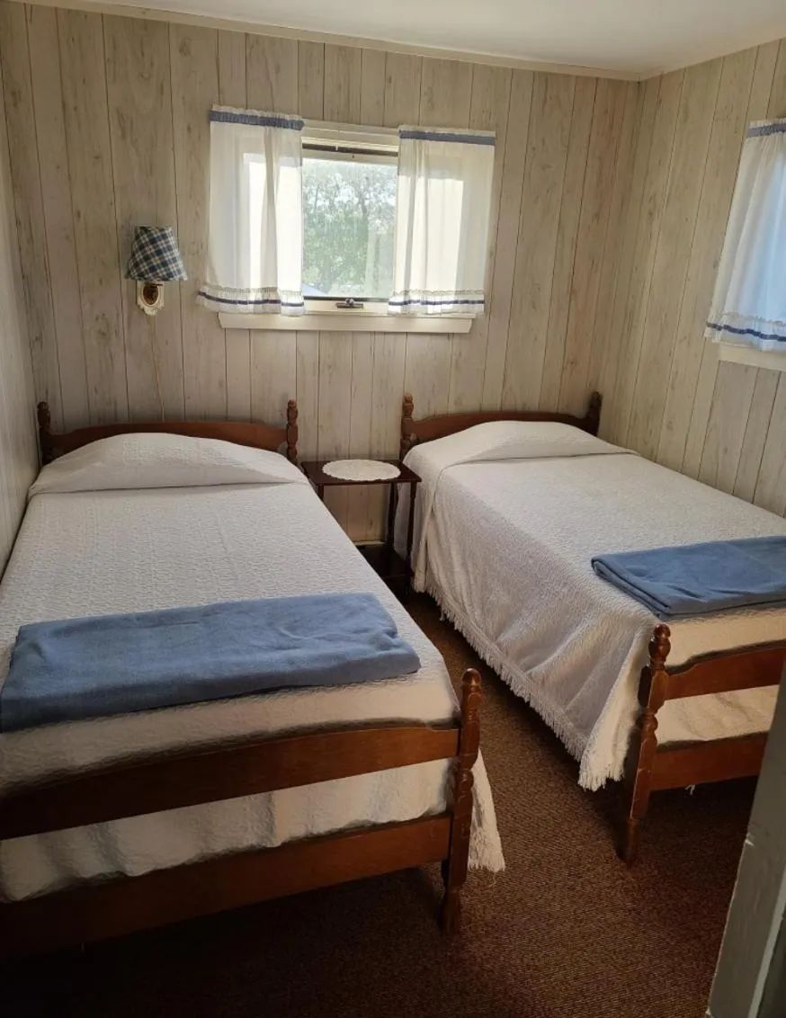 Bed in Moody's Motel and Cottages