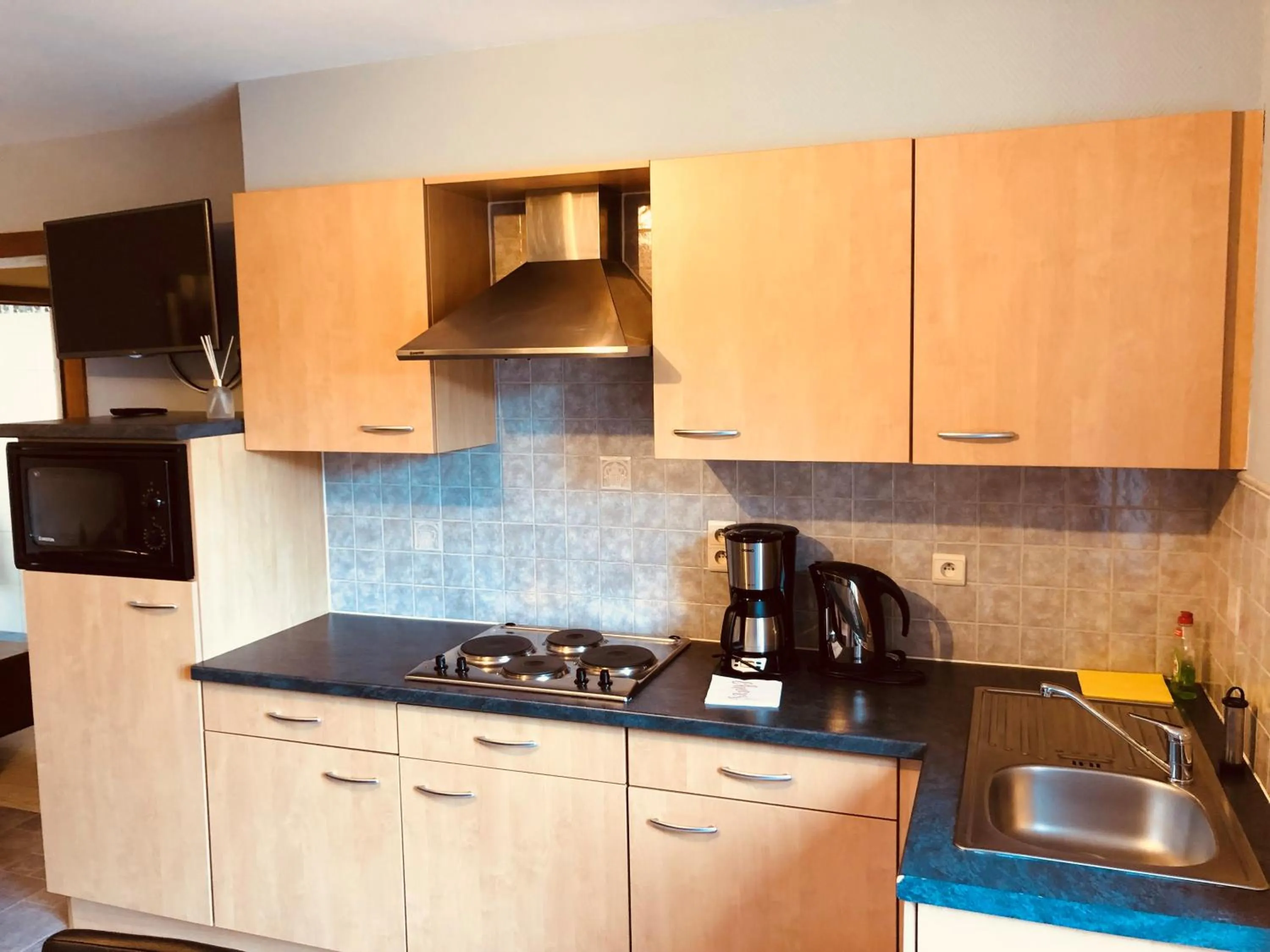 Coffee/tea facilities in Appart Hotel Au Pied de Vigne