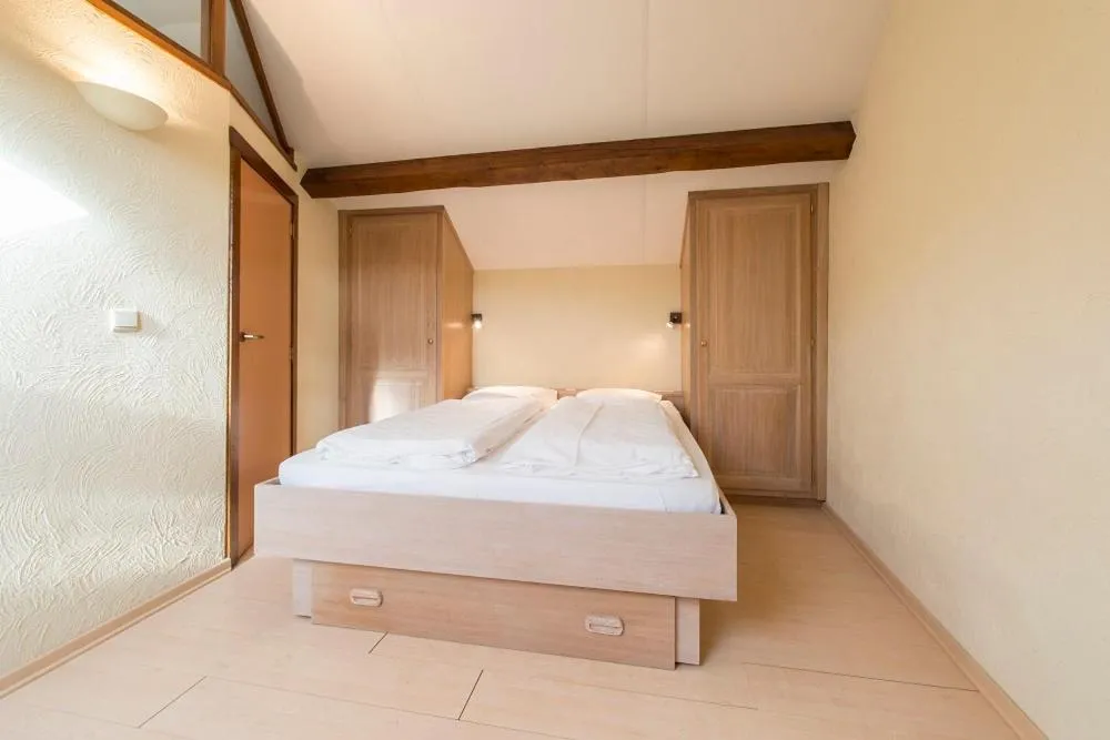 Bed in Appart Hotel Au Pied de Vigne