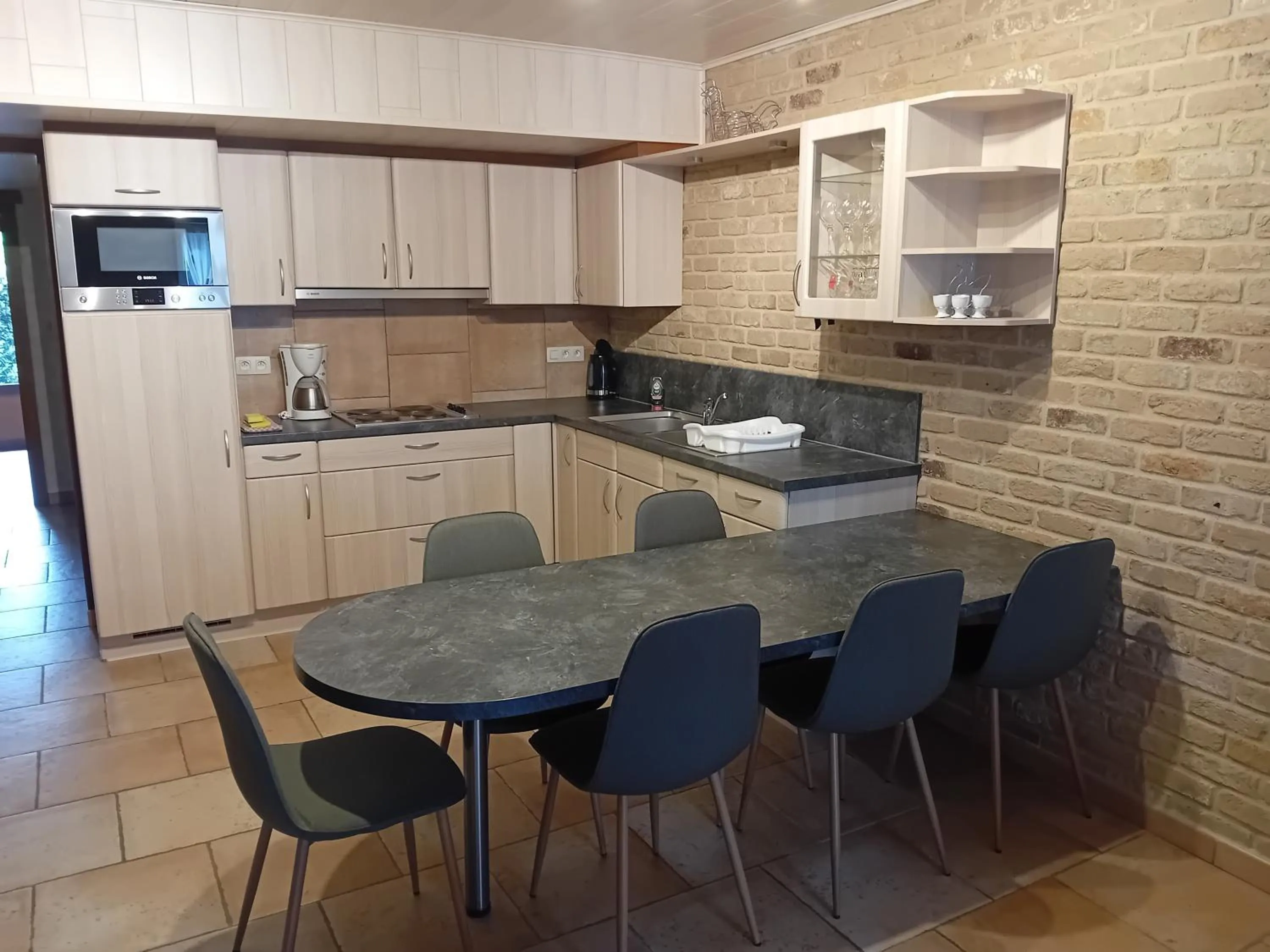 Kitchen or kitchenette in Appart Hotel Au Pied de Vigne