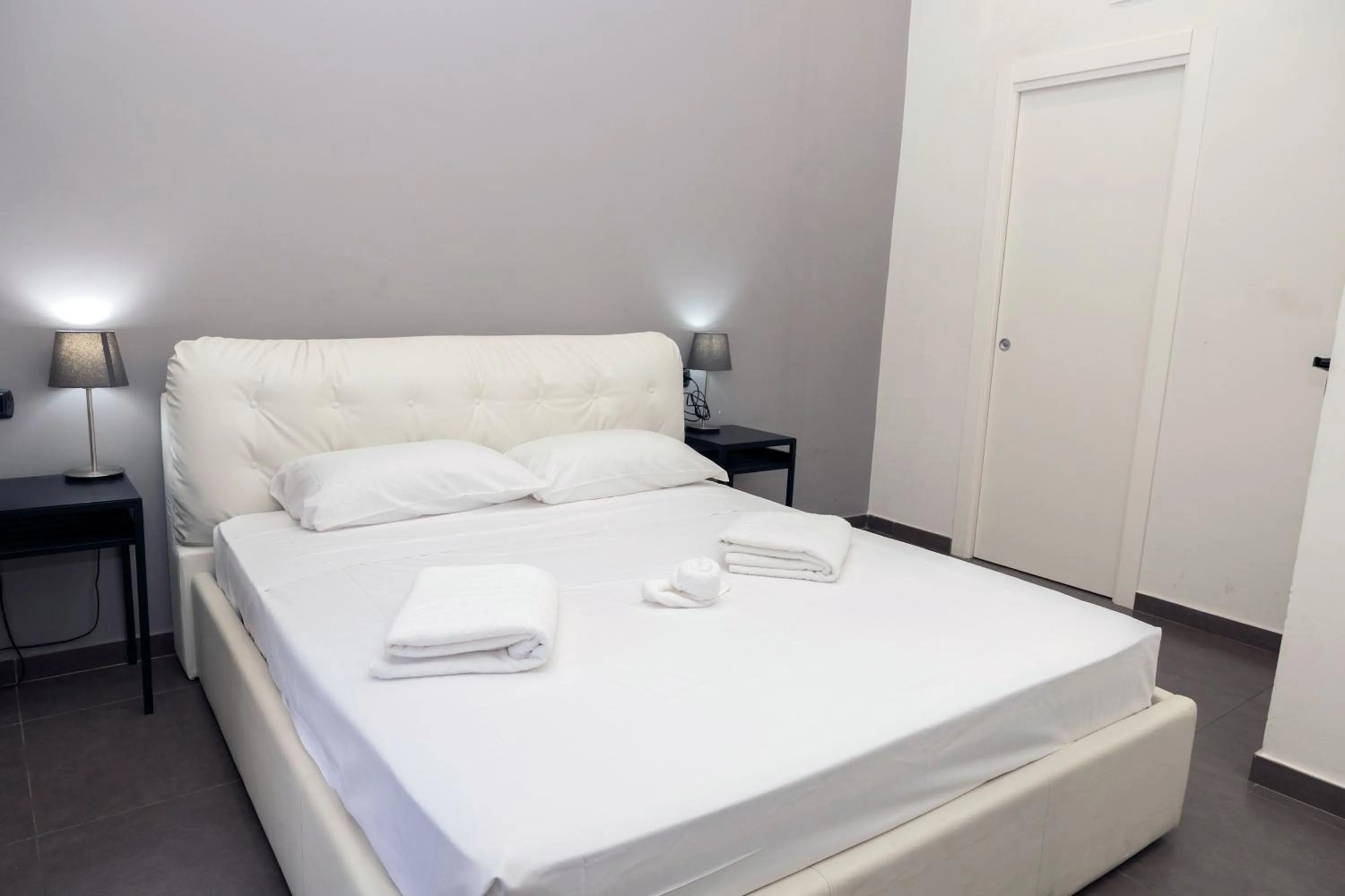 Bed in Doria Suites Napoli