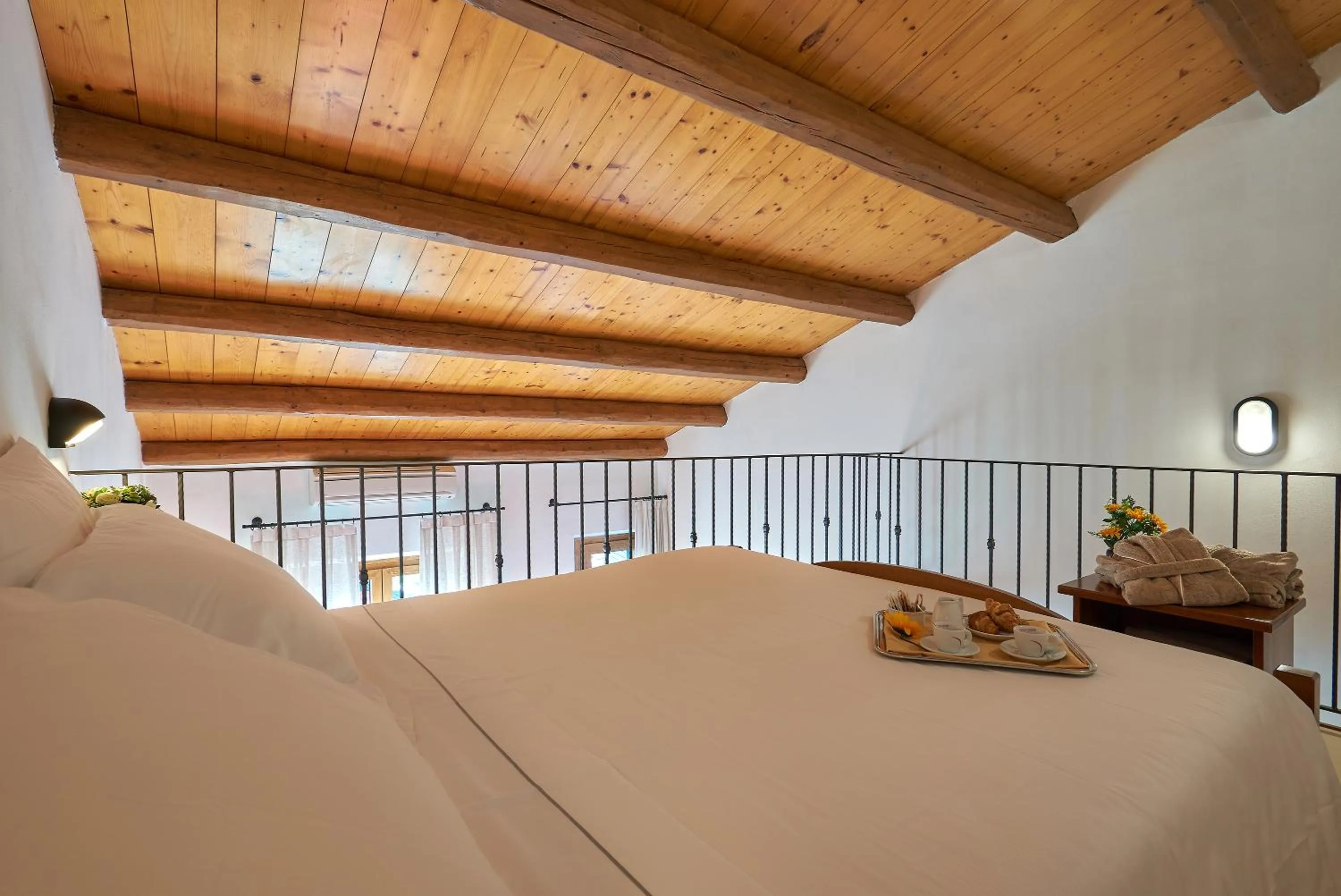 Bed in Casanova - Panoramic Rooms and Suites