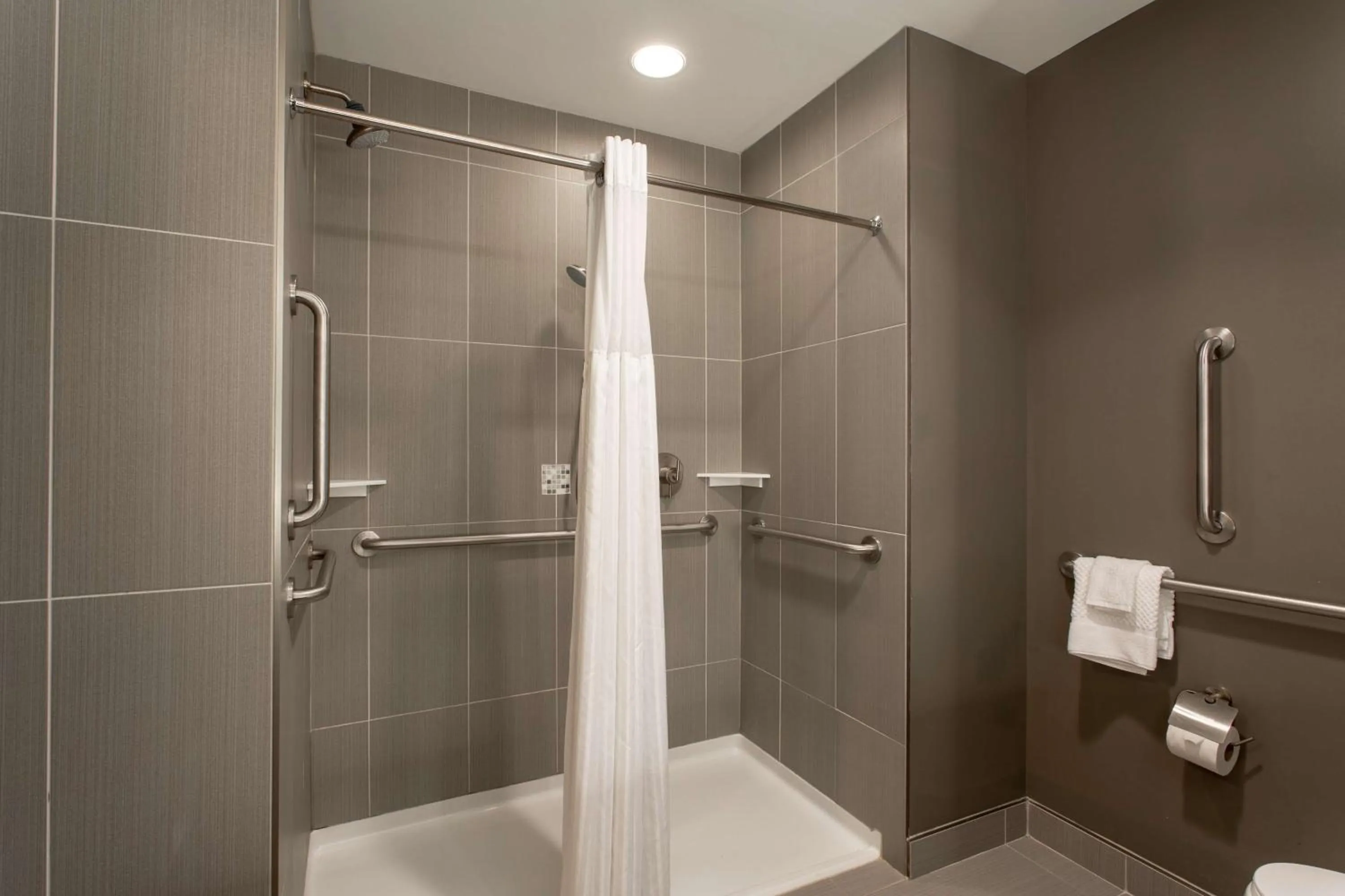 Bathroom in The Mosey Buffalo Williamsville Tapestry Collection Hilton