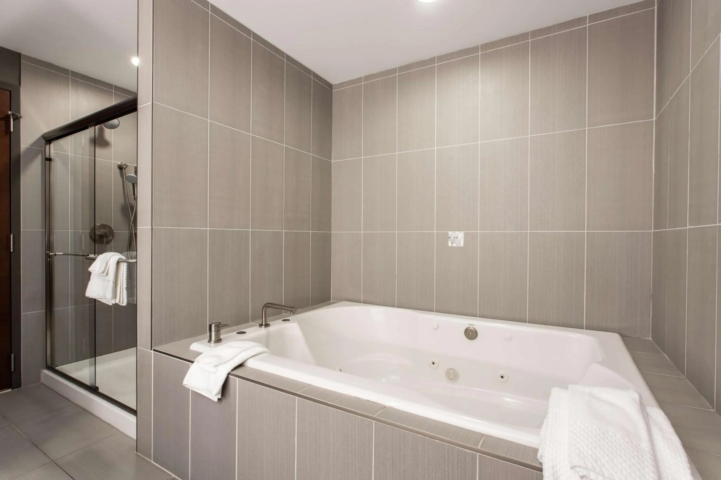 Bathroom in The Mosey Buffalo Williamsville Tapestry Collection Hilton