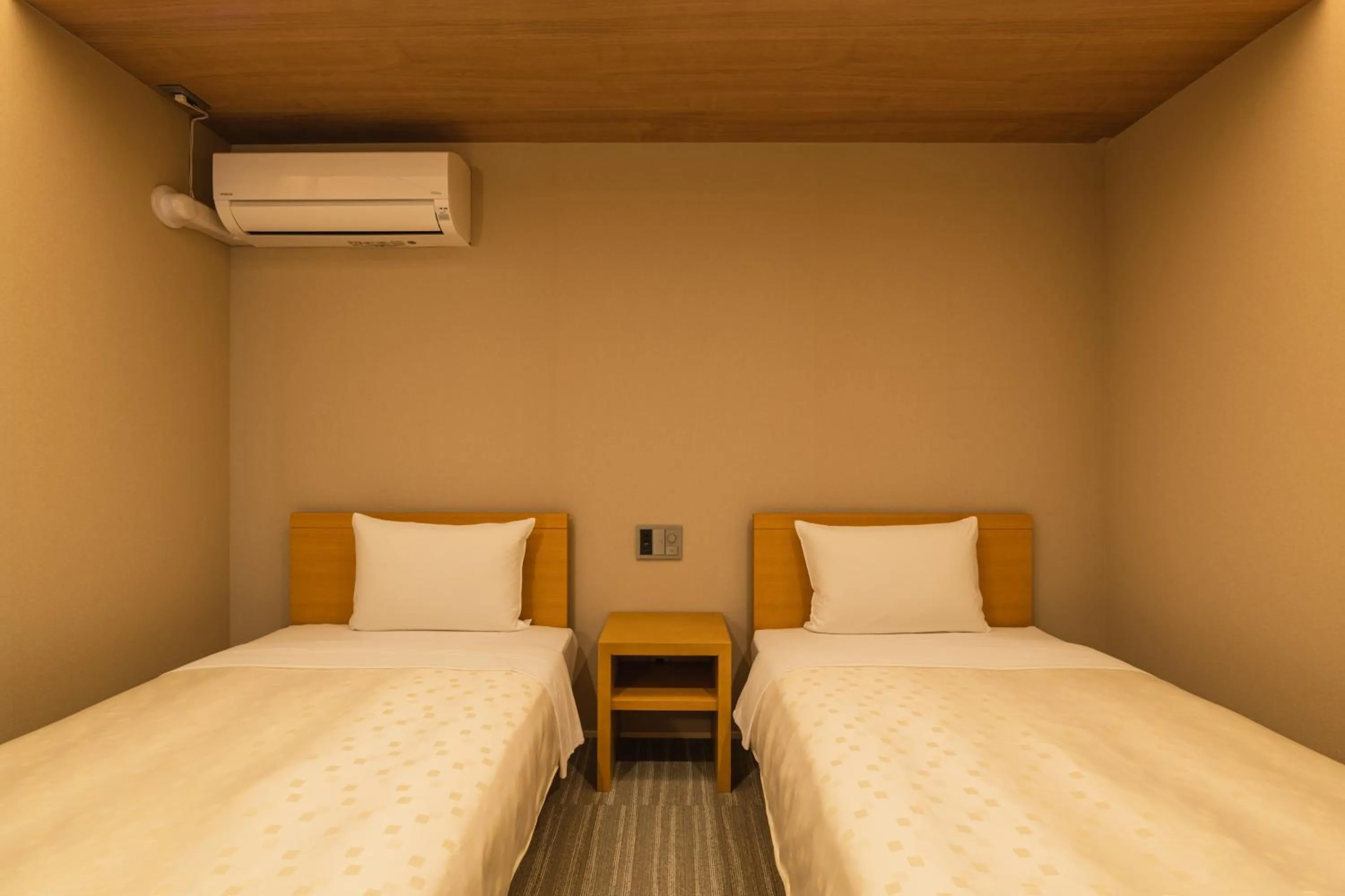 Bed in GRAND BASE Fukuoka Tenjin