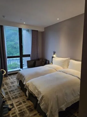 Bed in The Tango Hotel Taipei Shilin