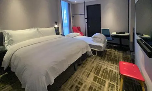 Bed in The Tango Hotel Taipei Shilin