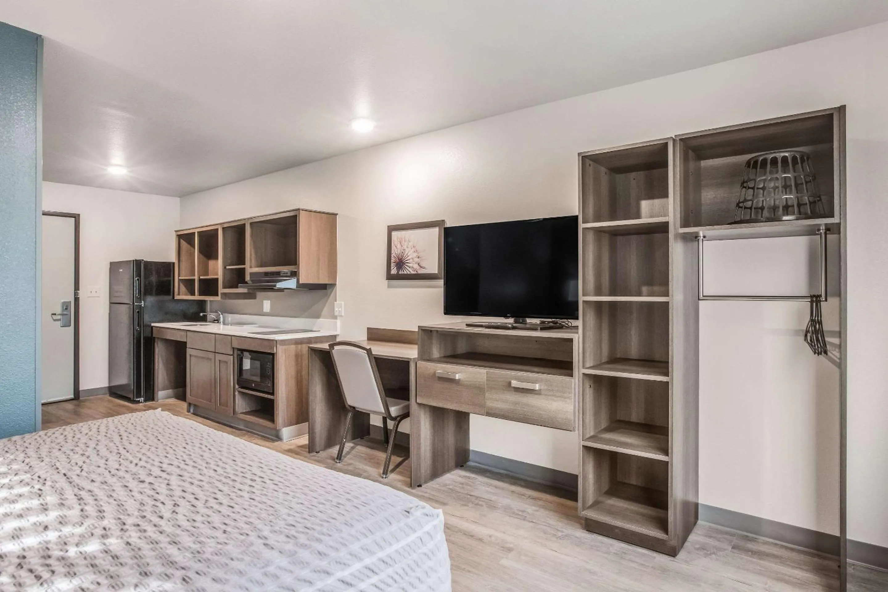 Photo of the whole room, Bed in WoodSpring Suites Atlanta McDonough