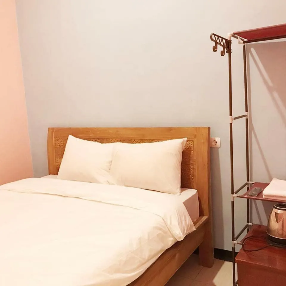 Bed in RoomZ Budget Residence