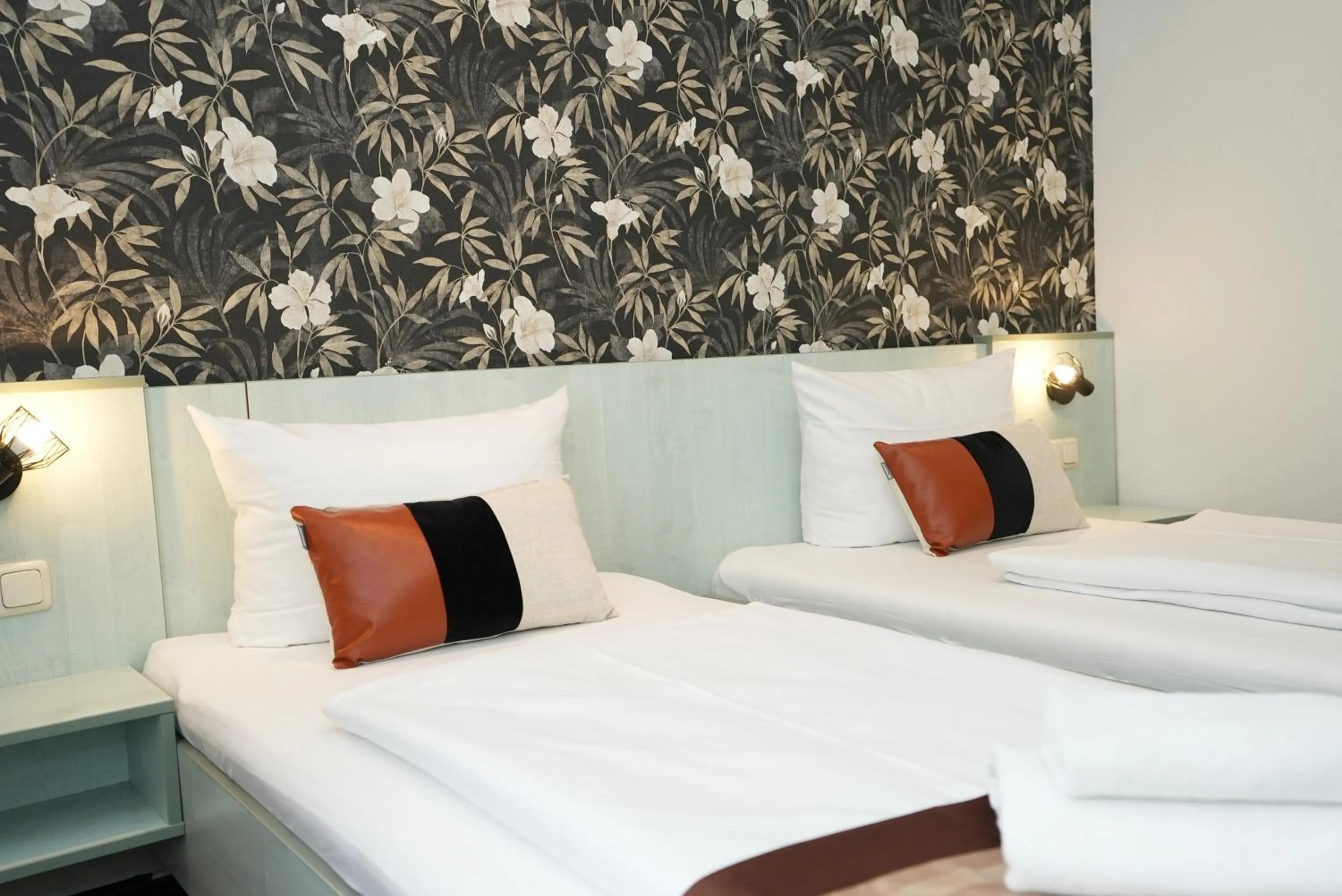 Bed in Hotel Attaché an der Messe