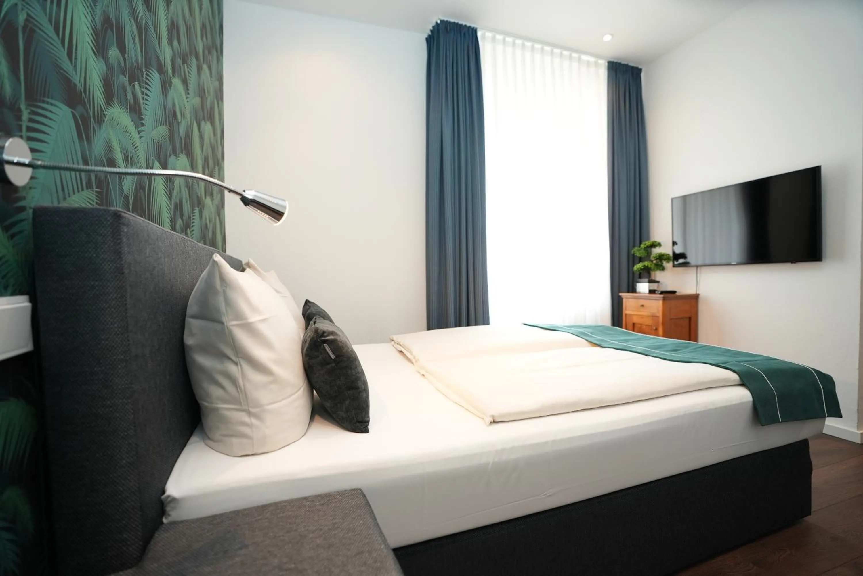 Bed in Hotel Attaché an der Messe