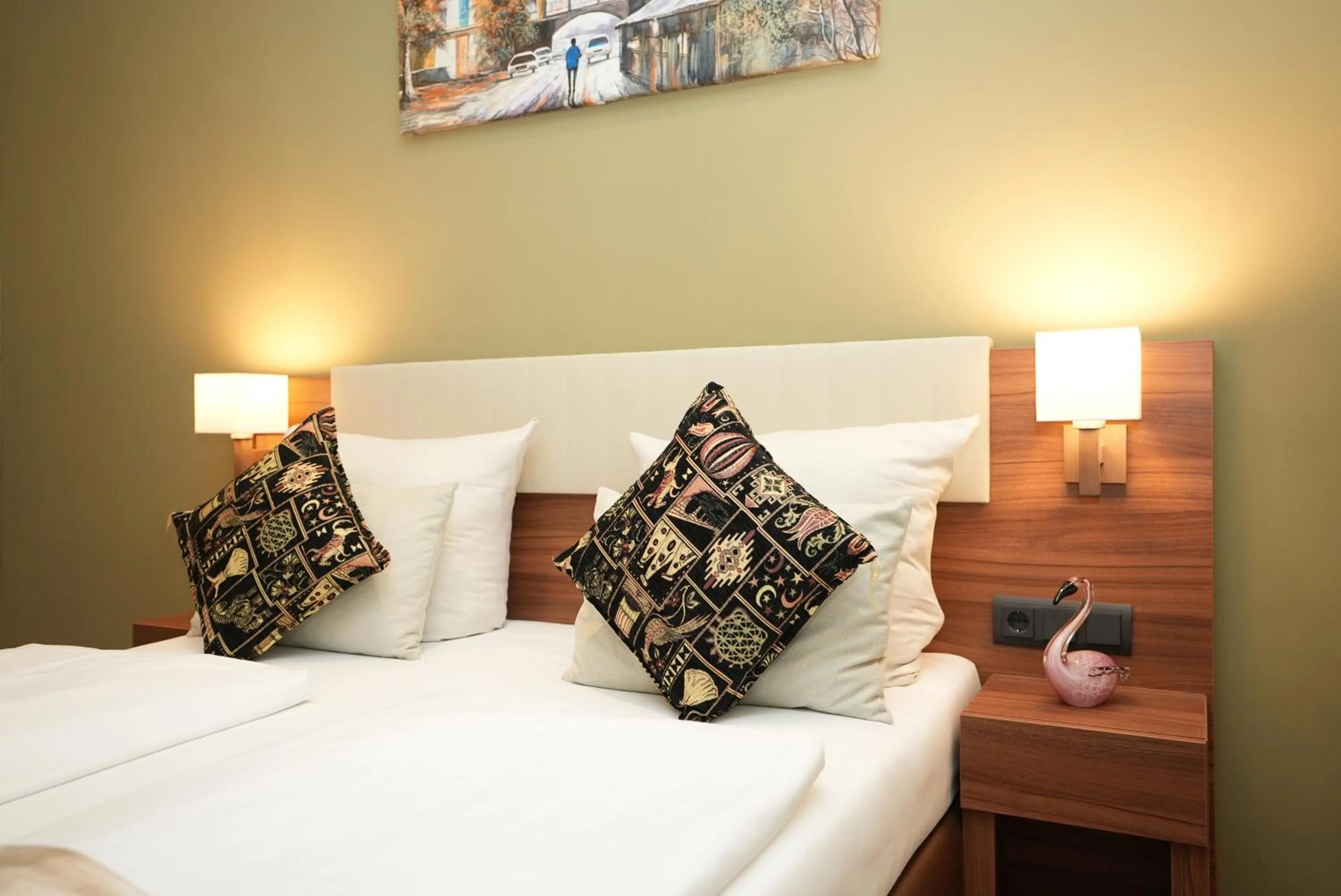 Bed in Hotel Attaché an der Messe