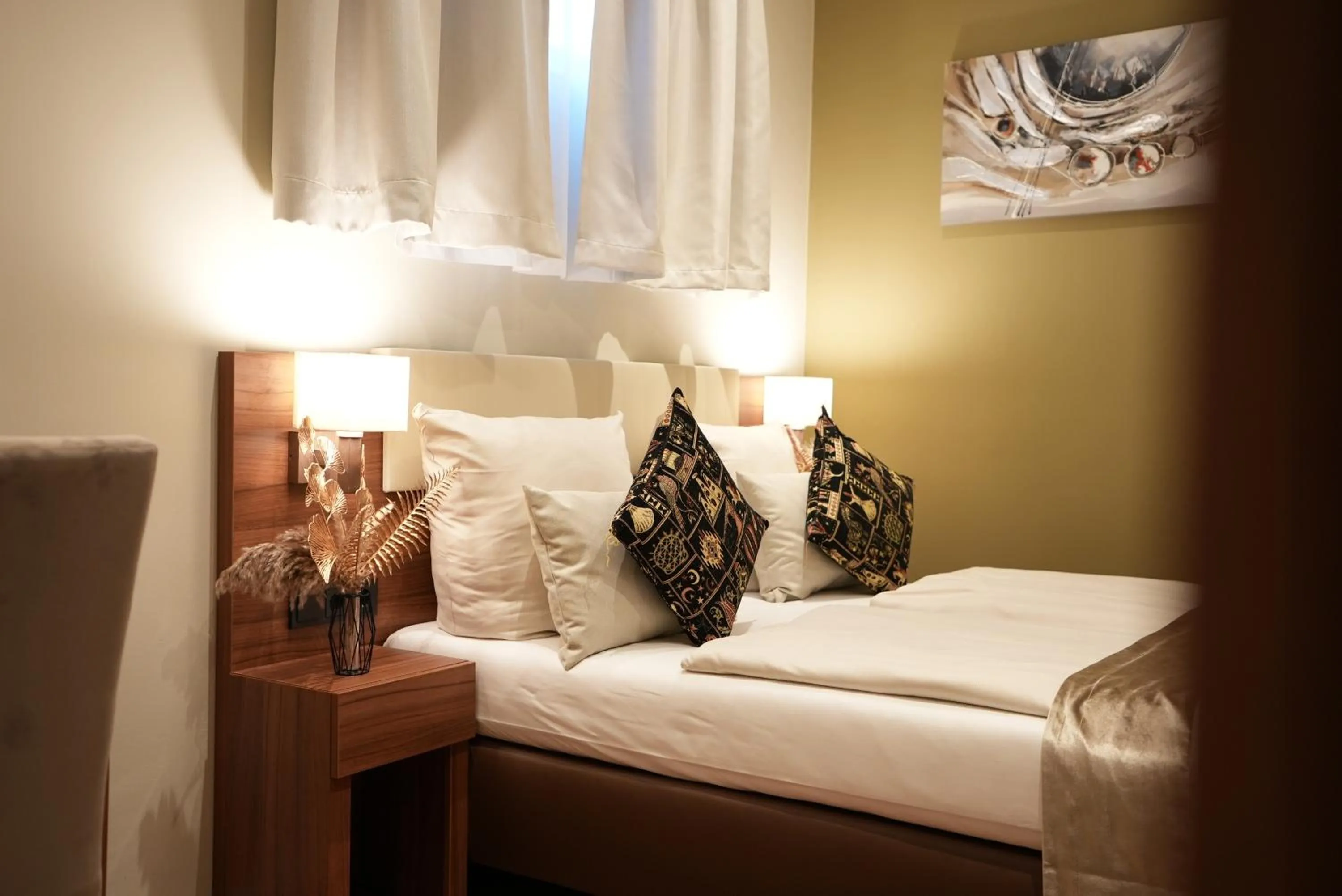 Bed in Hotel Attaché an der Messe