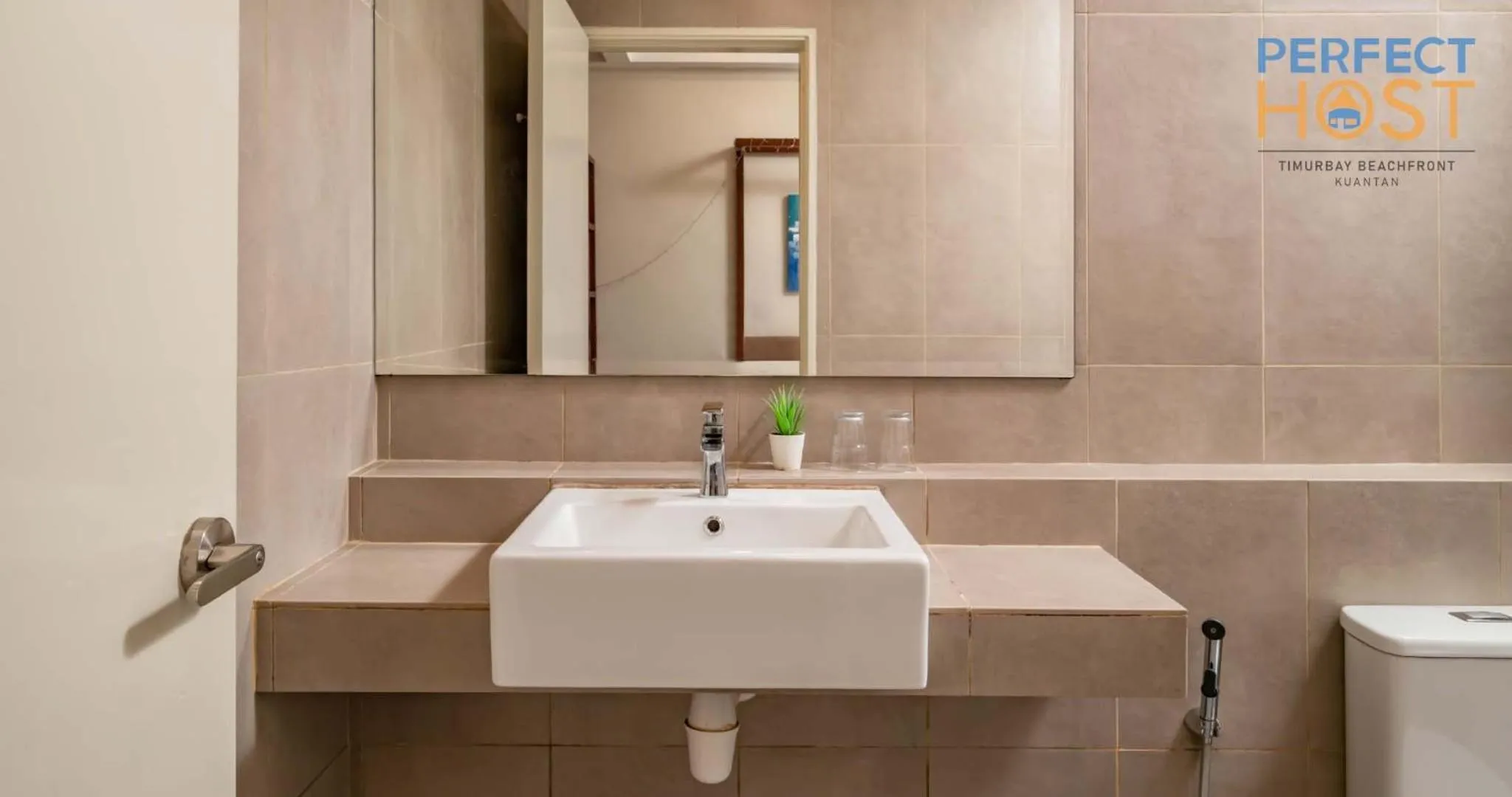 Bathroom in Timurbay Beachfront by Perfect Host