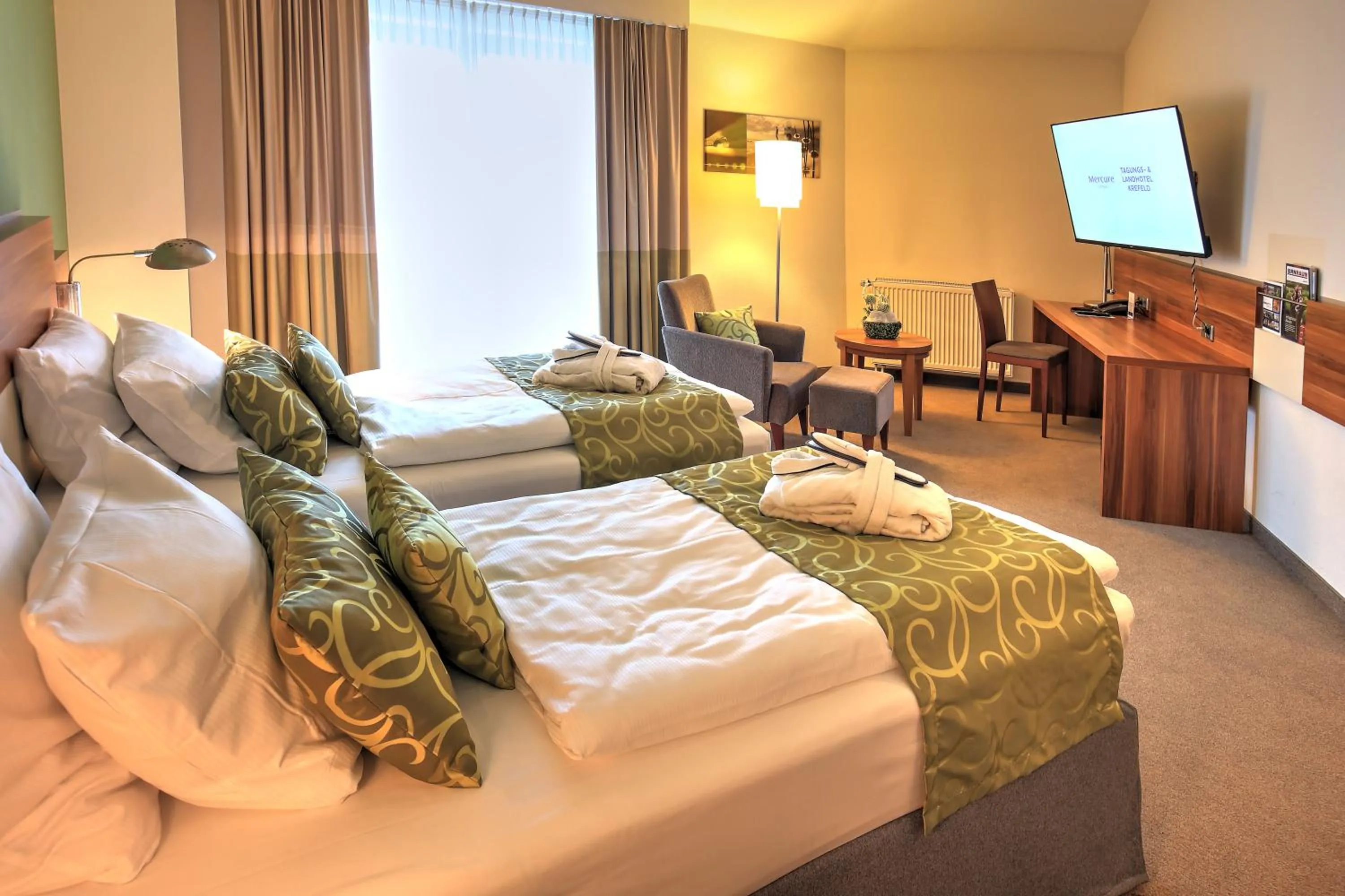 Photo of the whole room, Bed in Mercure Tagungs- & Landhotel Krefeld