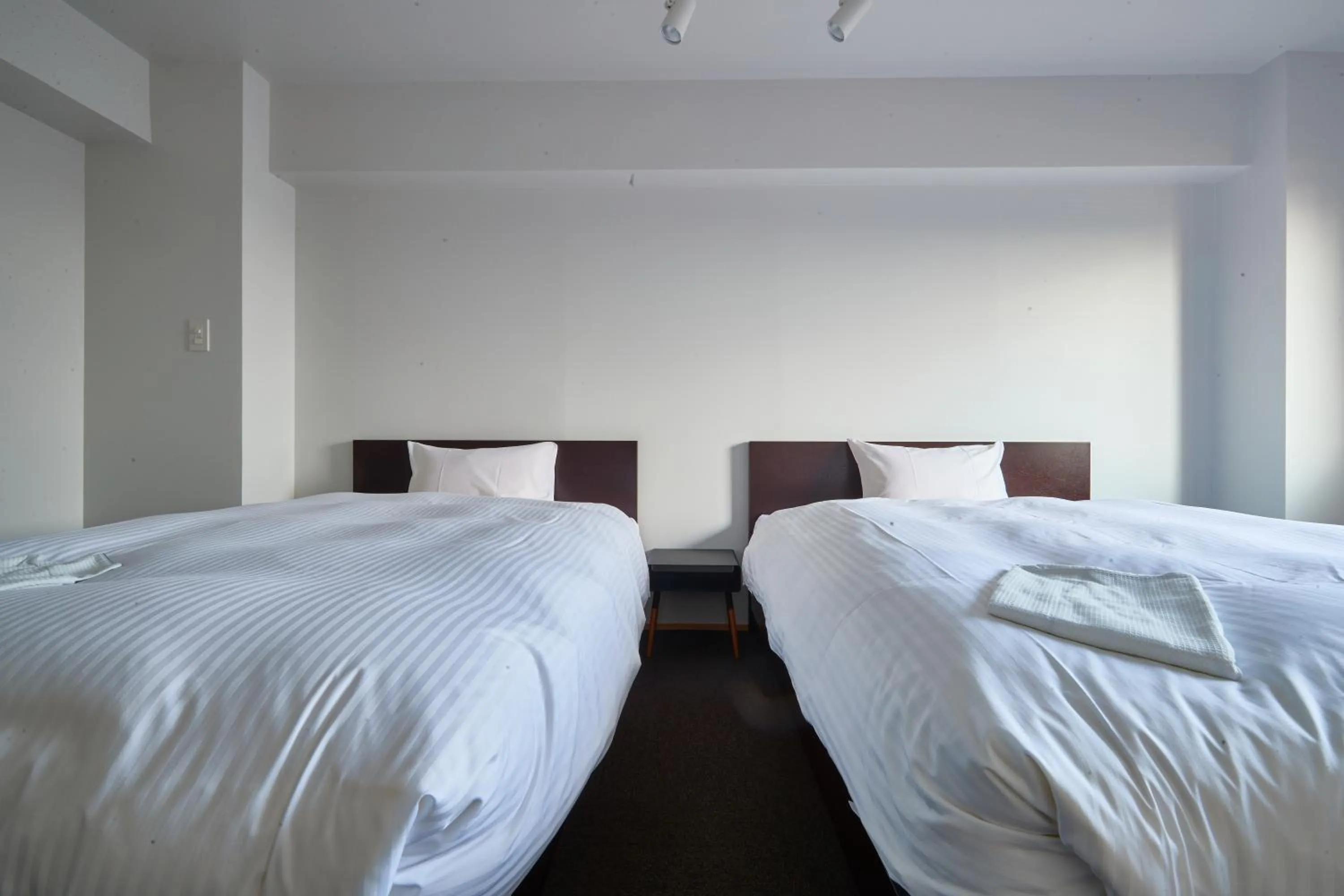 Bed in 8HOTEL Chigasaki
