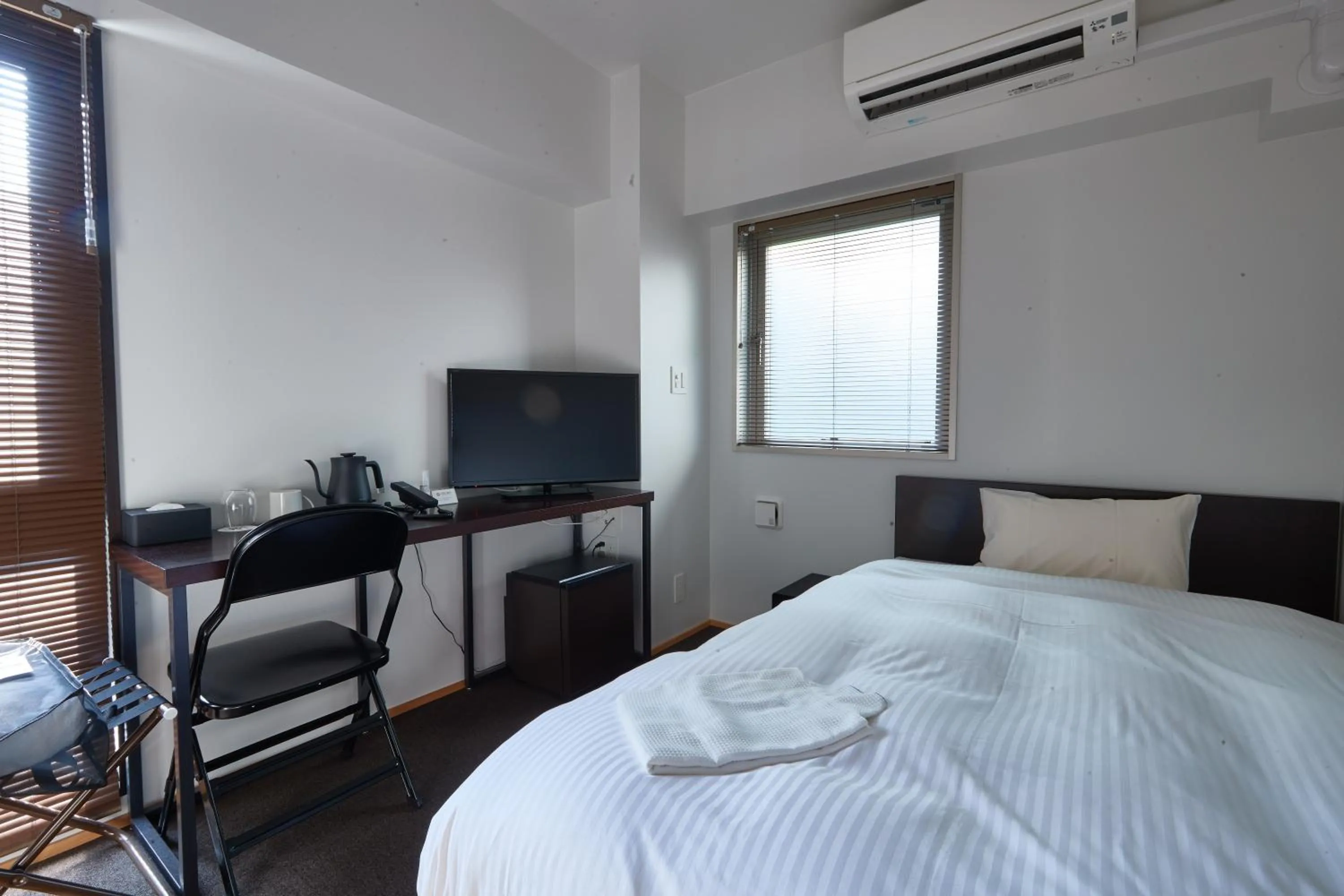 Bed in 8HOTEL Chigasaki