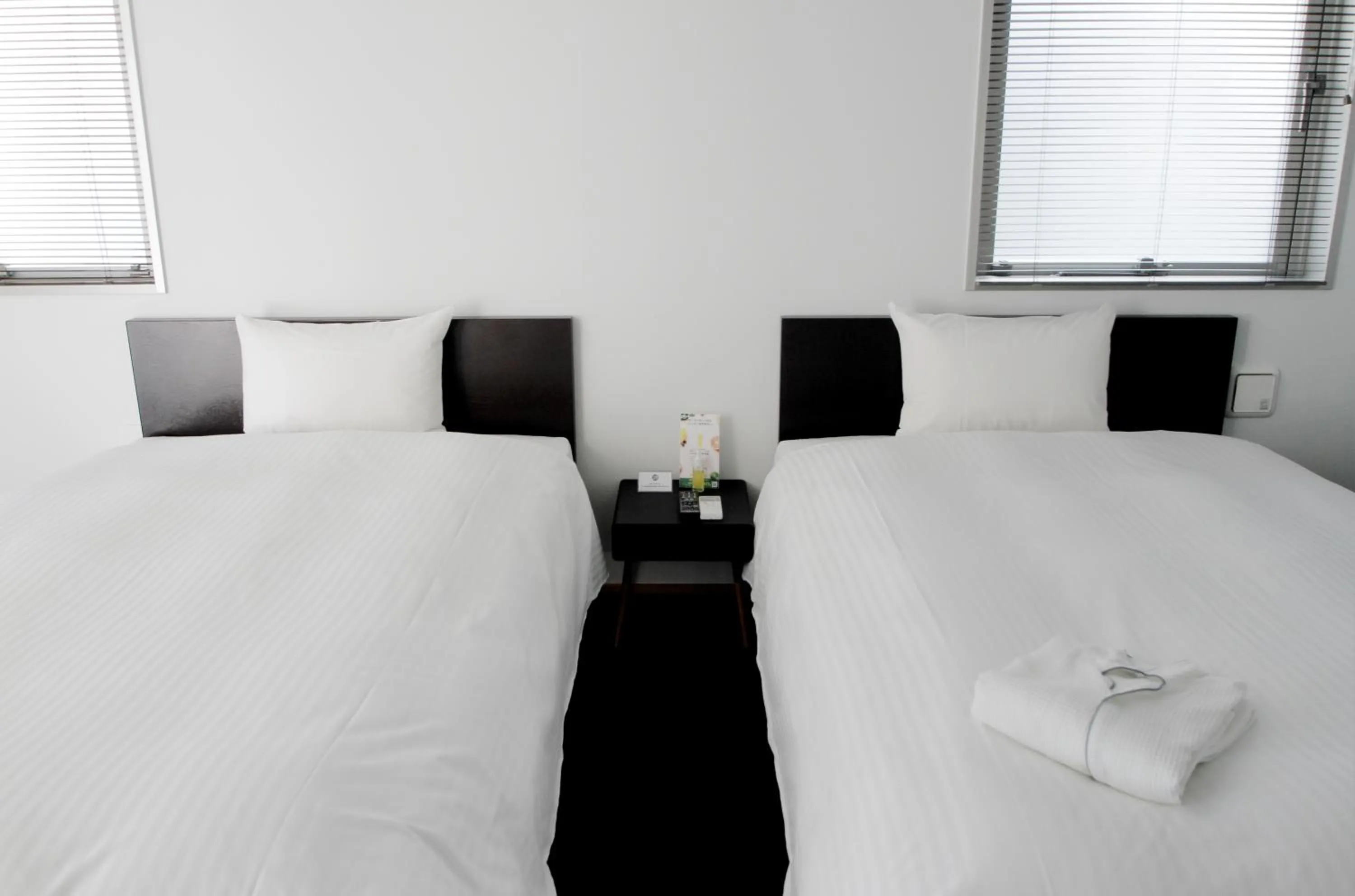 Bed in 8HOTEL Chigasaki