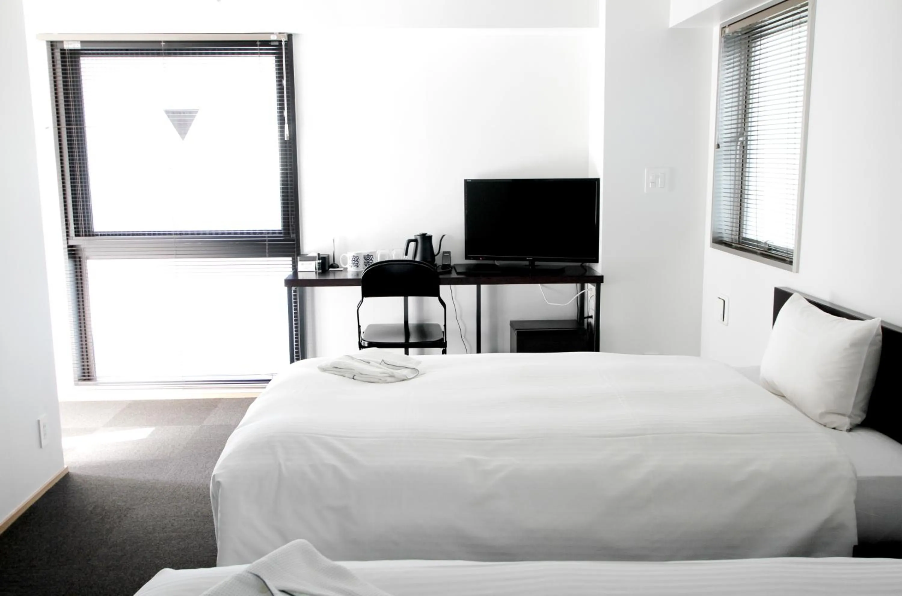 Bed in 8HOTEL Chigasaki