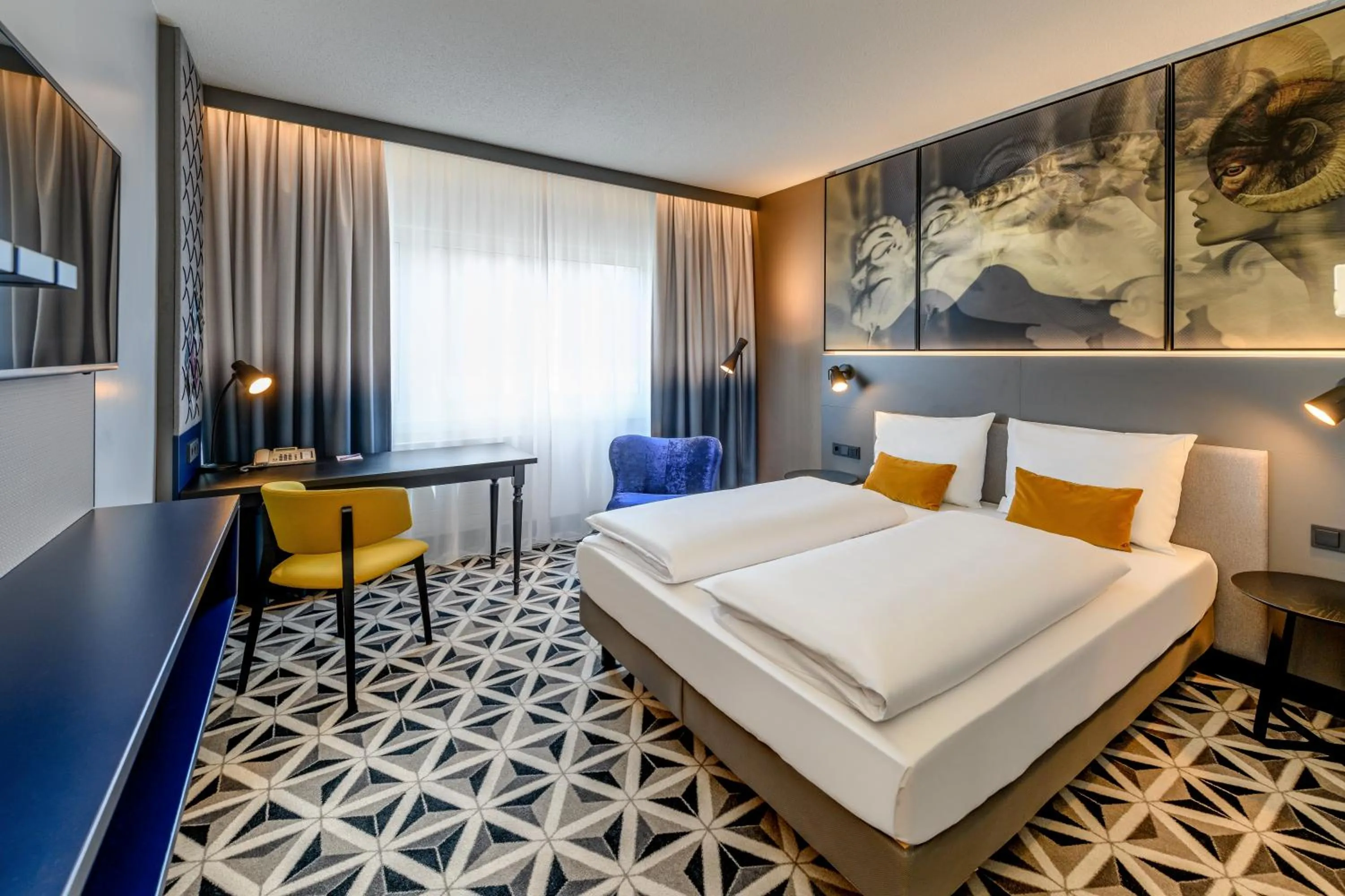 Photo of the whole room, Bed in Mercure Hotel Freiburg am Münster