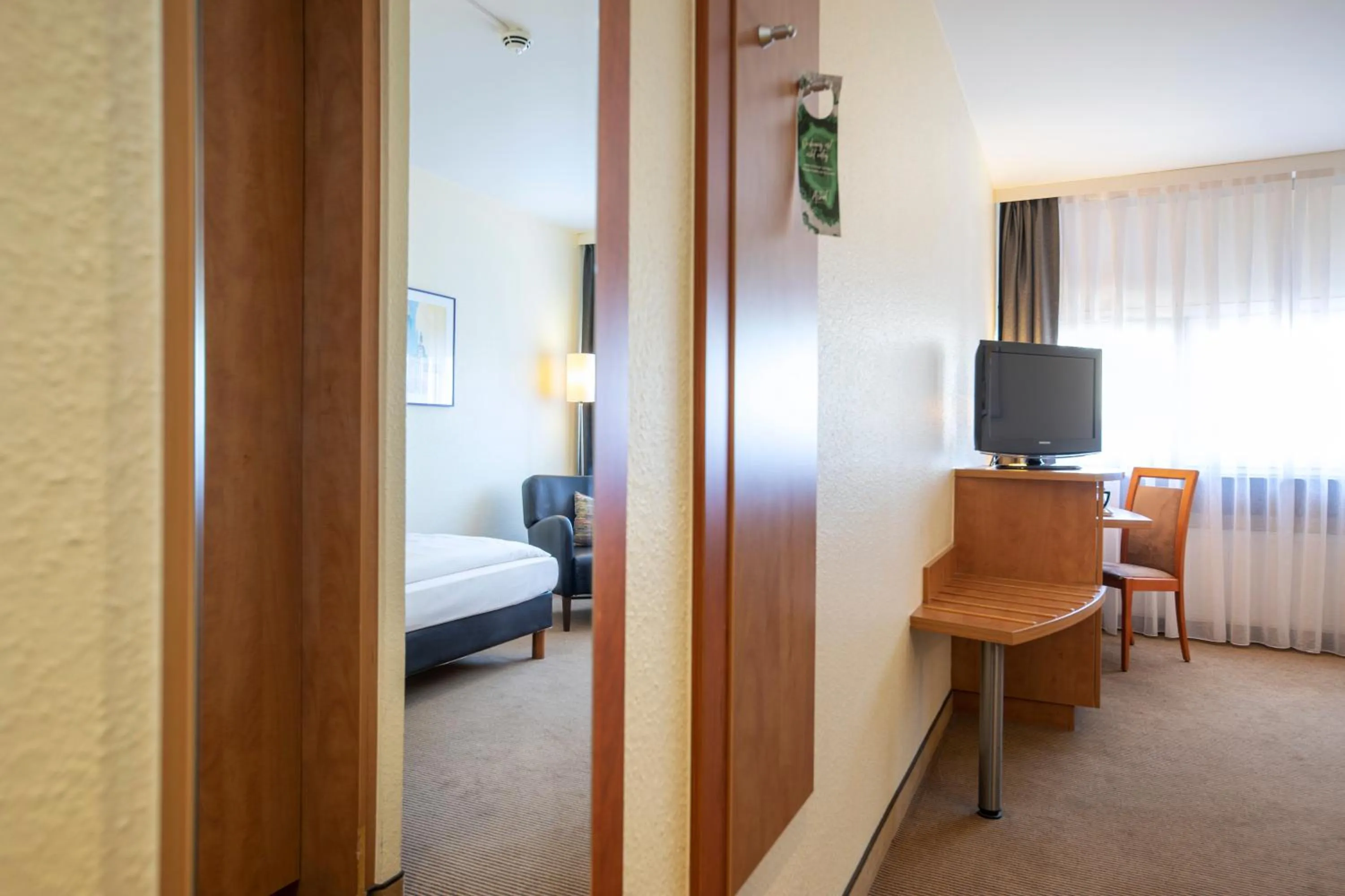 Photo of the whole room, Bed in ACHAT Hotel Braunschweig