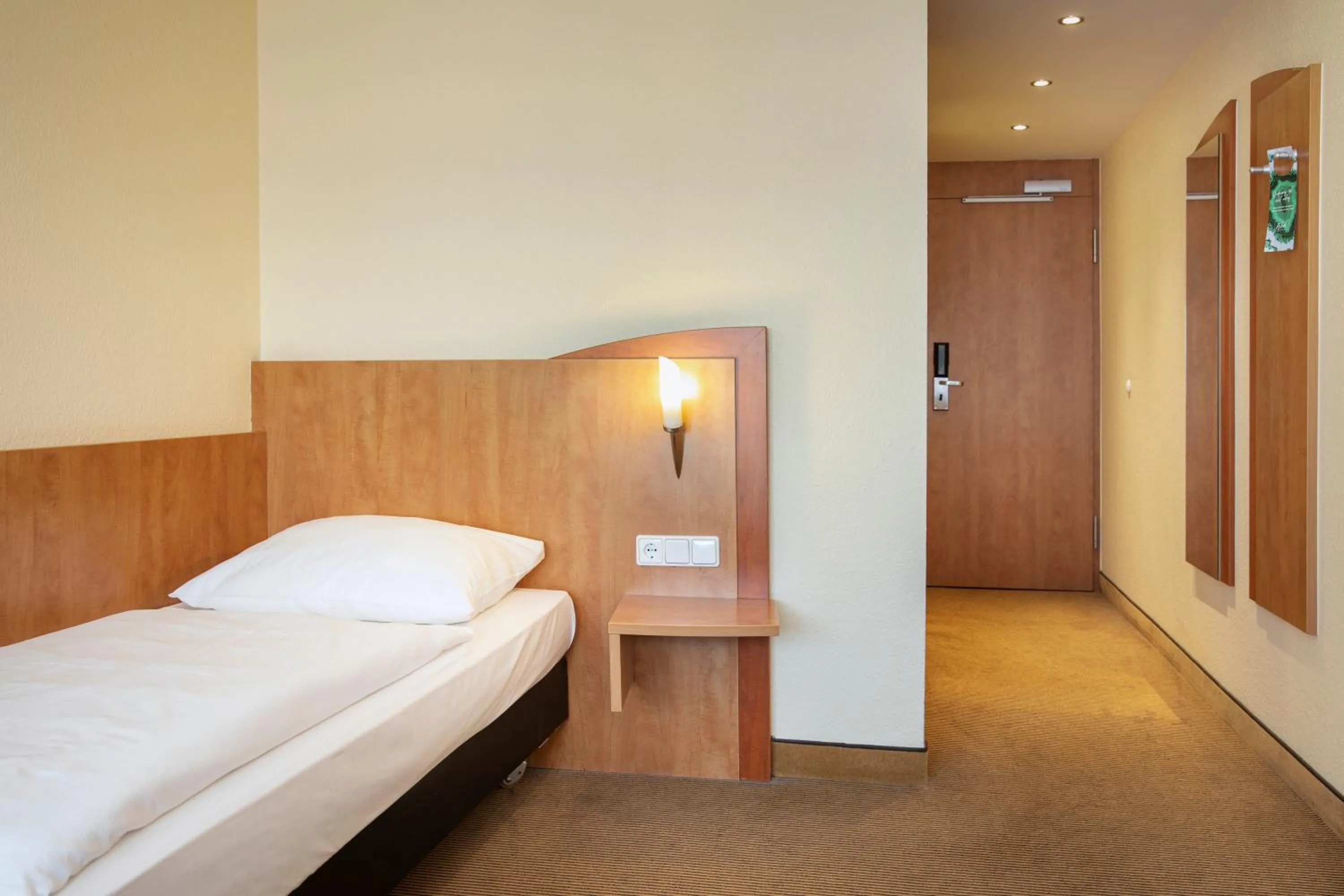 Photo of the whole room, Bed in ACHAT Hotel Braunschweig