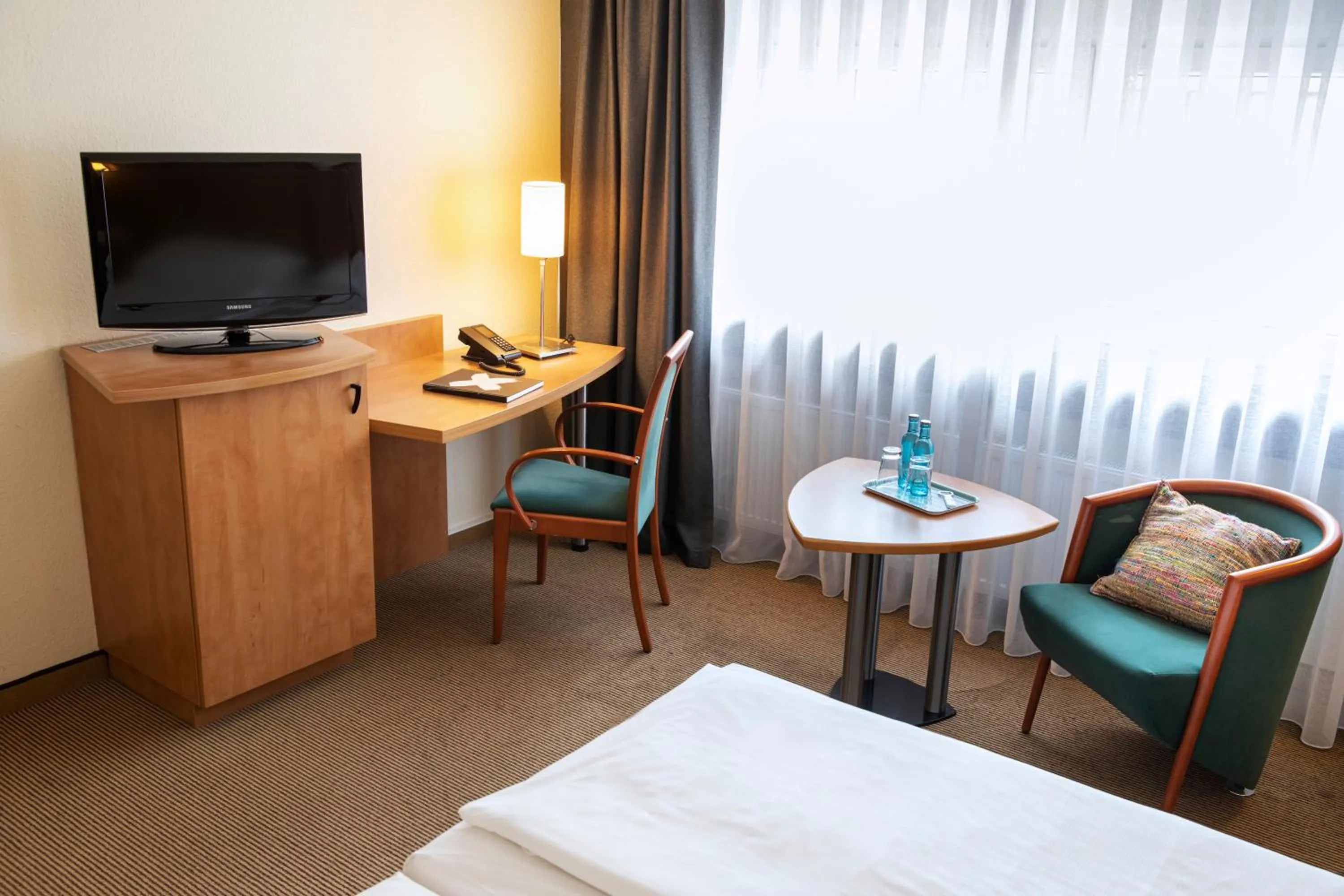 Photo of the whole room, Bed in ACHAT Hotel Braunschweig