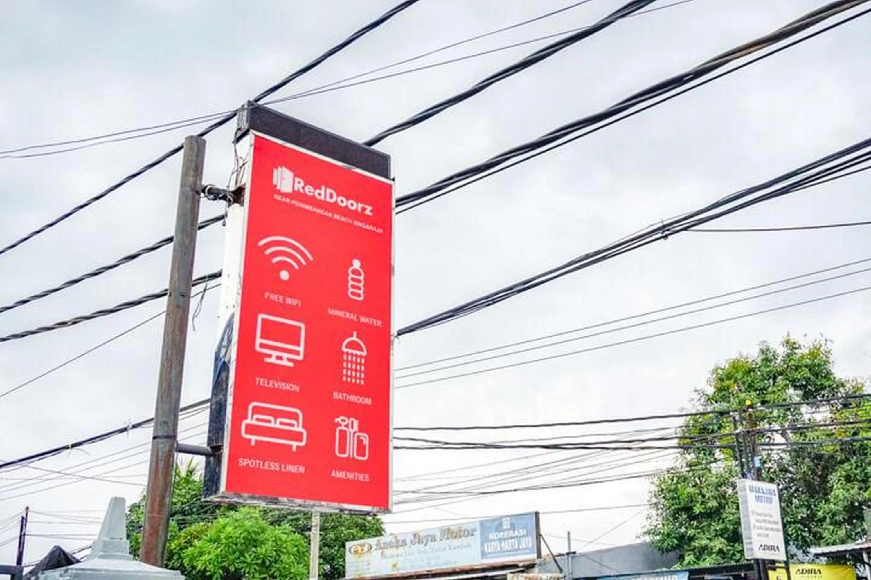 Property logo or sign in RedDoorz near Penimbangan Beach Singaraja