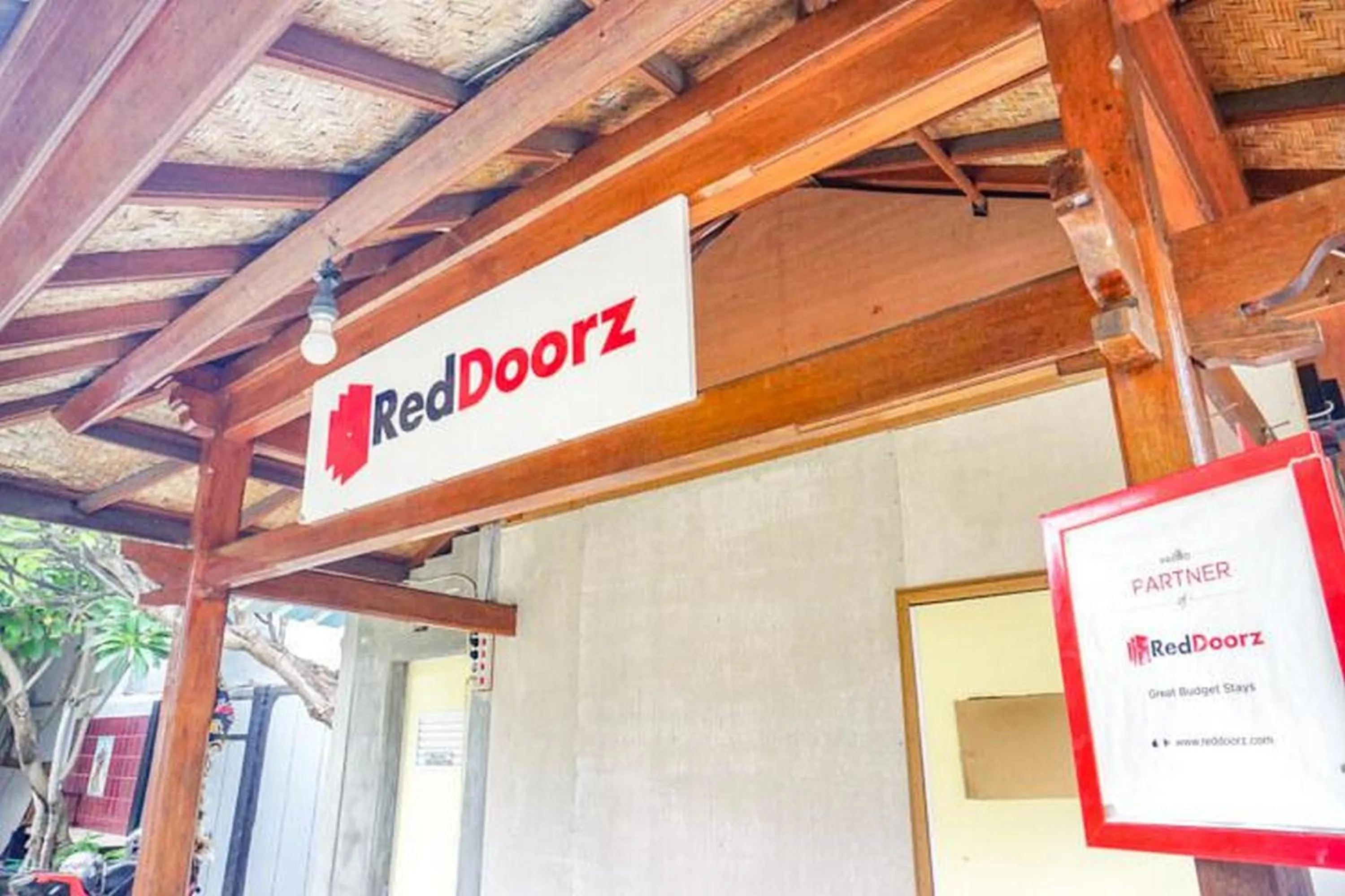 Property logo or sign in RedDoorz near Penimbangan Beach Singaraja