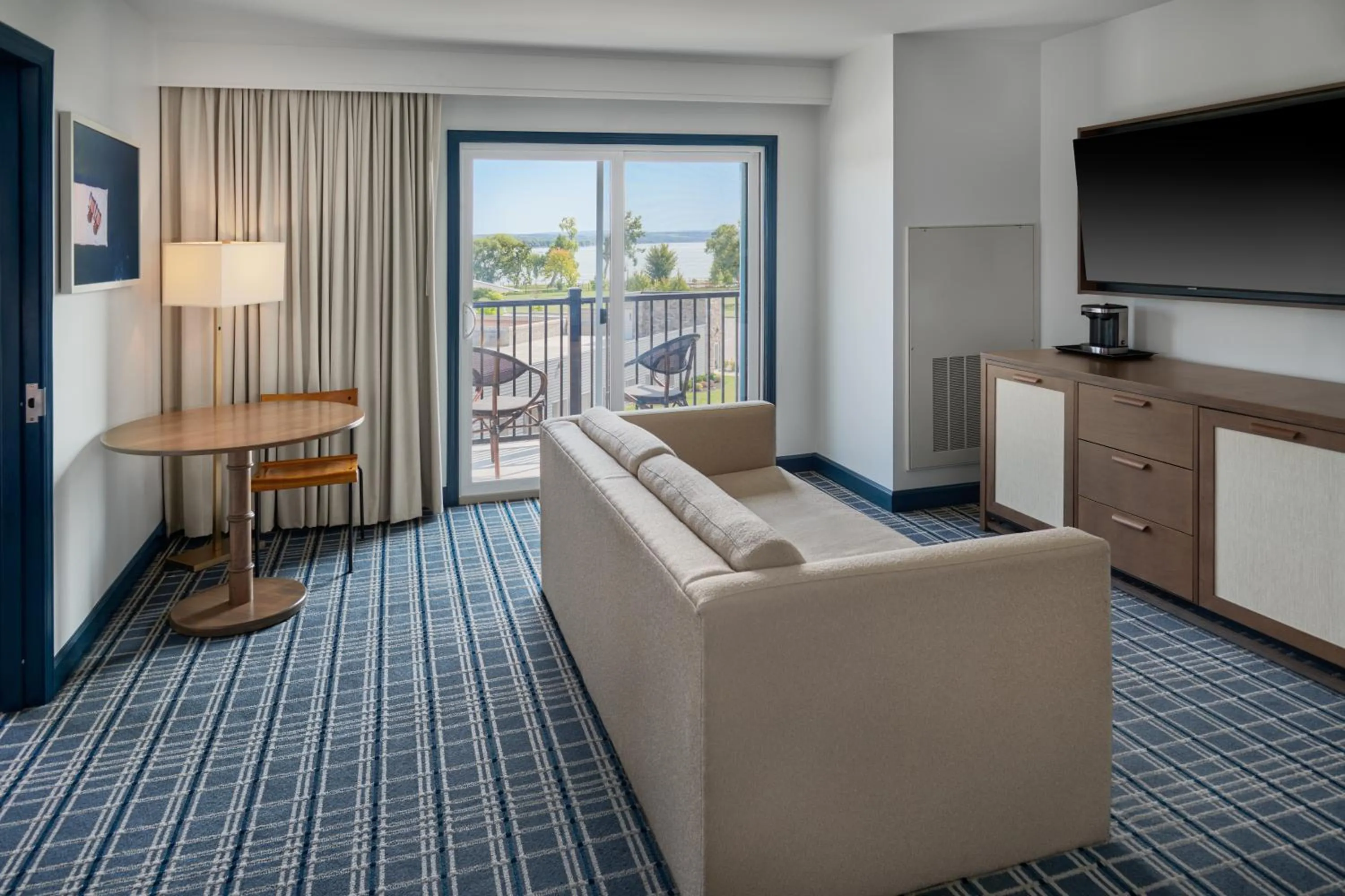 Living room in Hotel Canandaigua, Tapestry Collection By Hilton