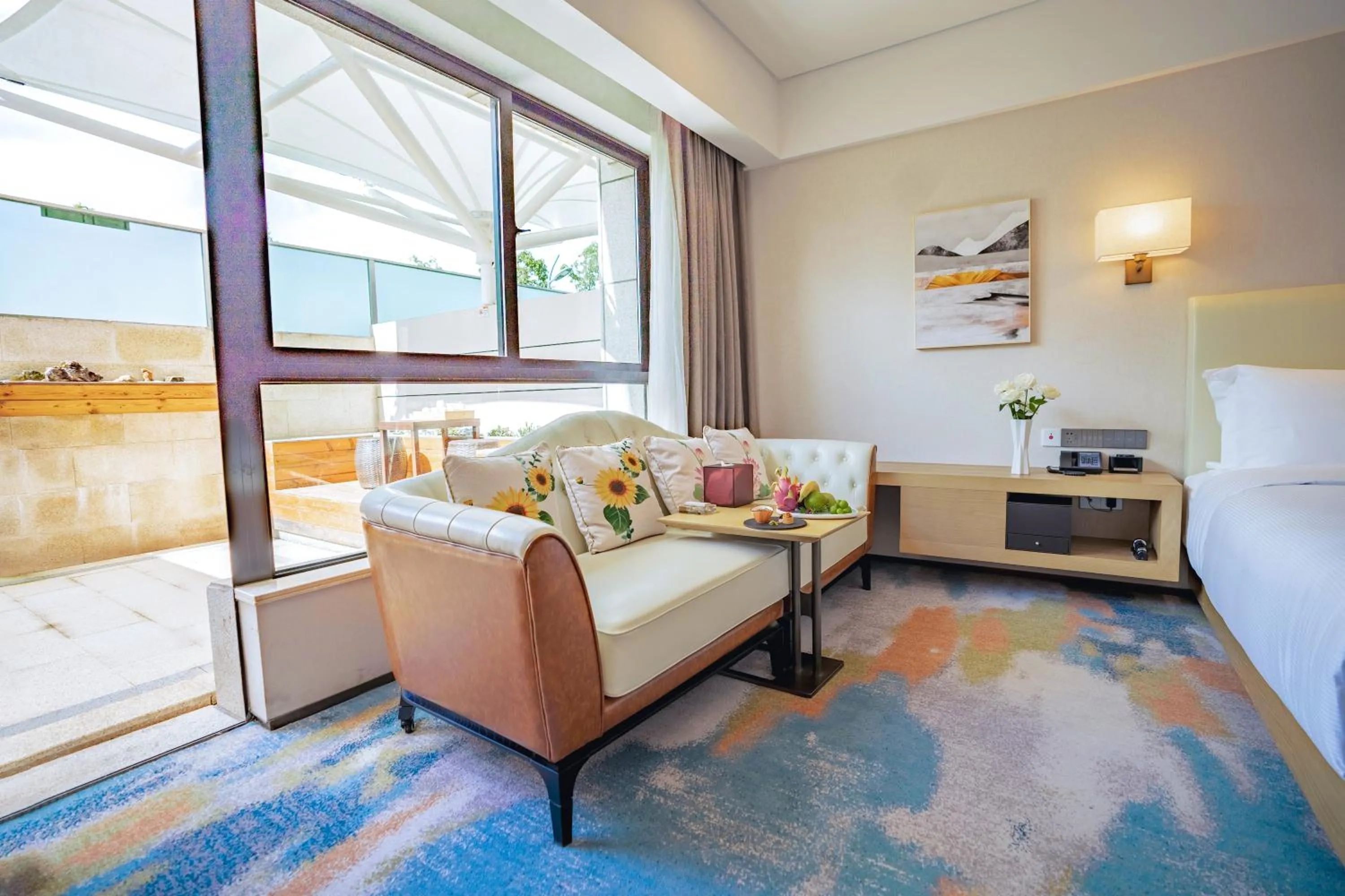 Seating area, Bed in Hilton Lijiang