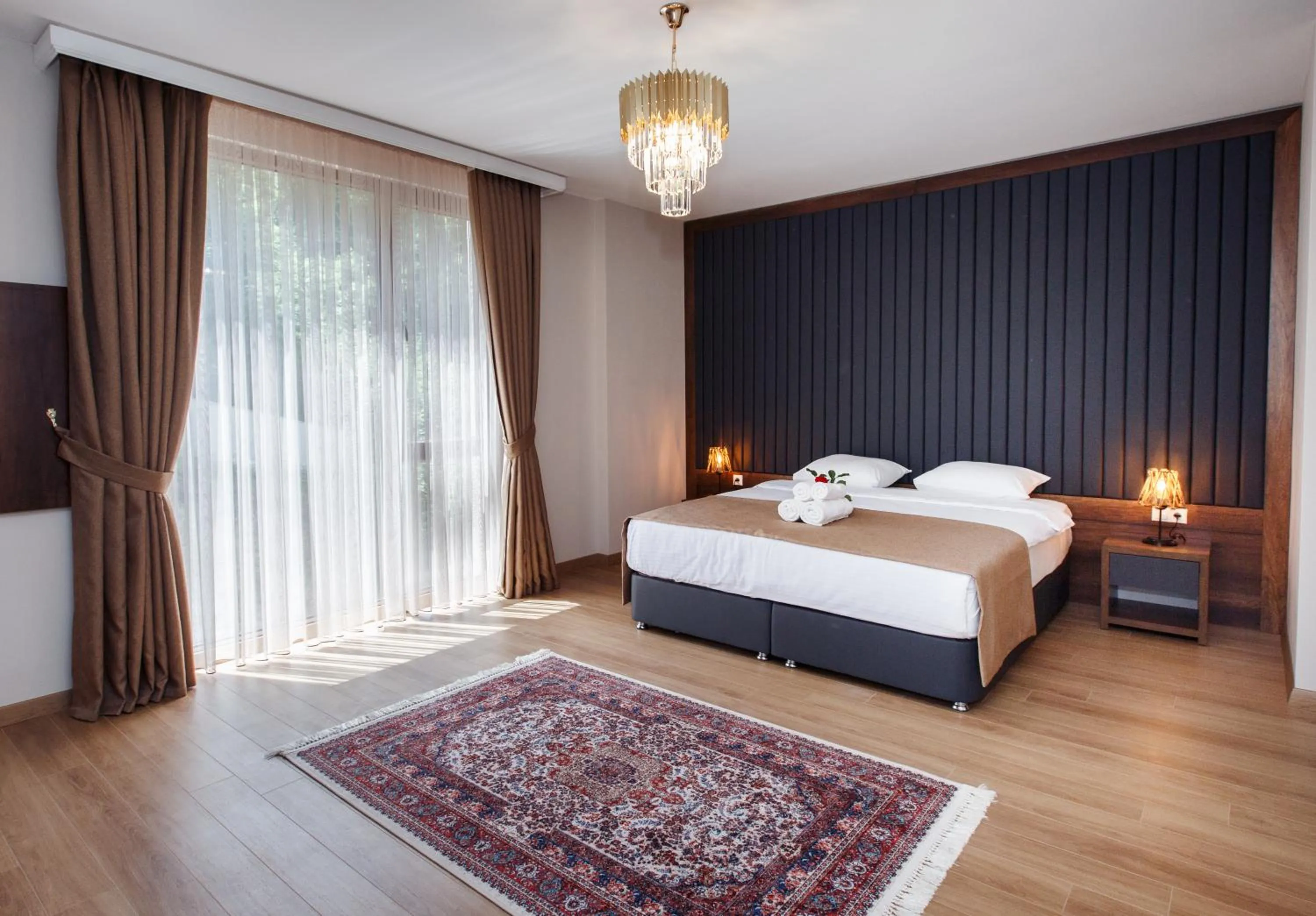 Property building, Bed in Armoni Deluxe Suites Trabzon