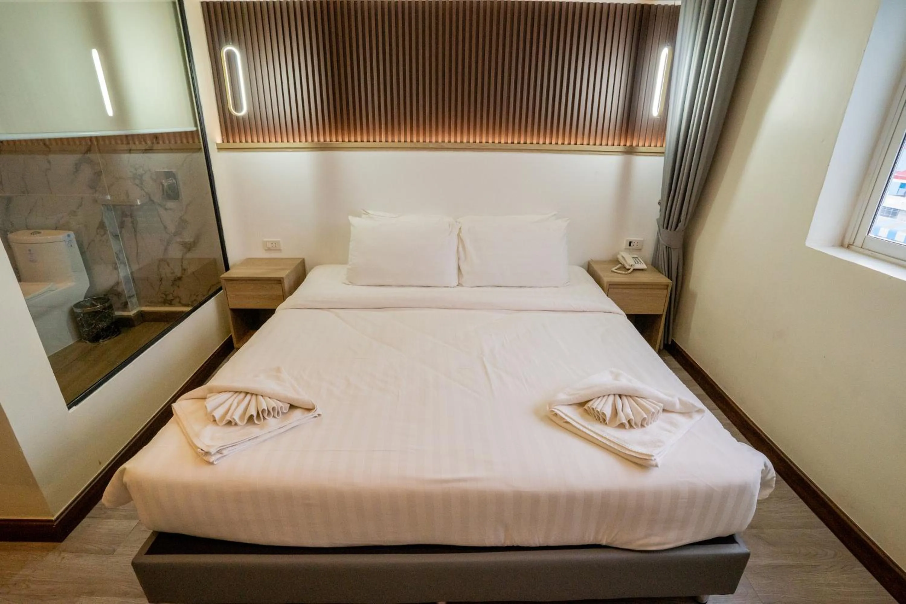 Photo of the whole room, Bed in Hak Heng Hotel