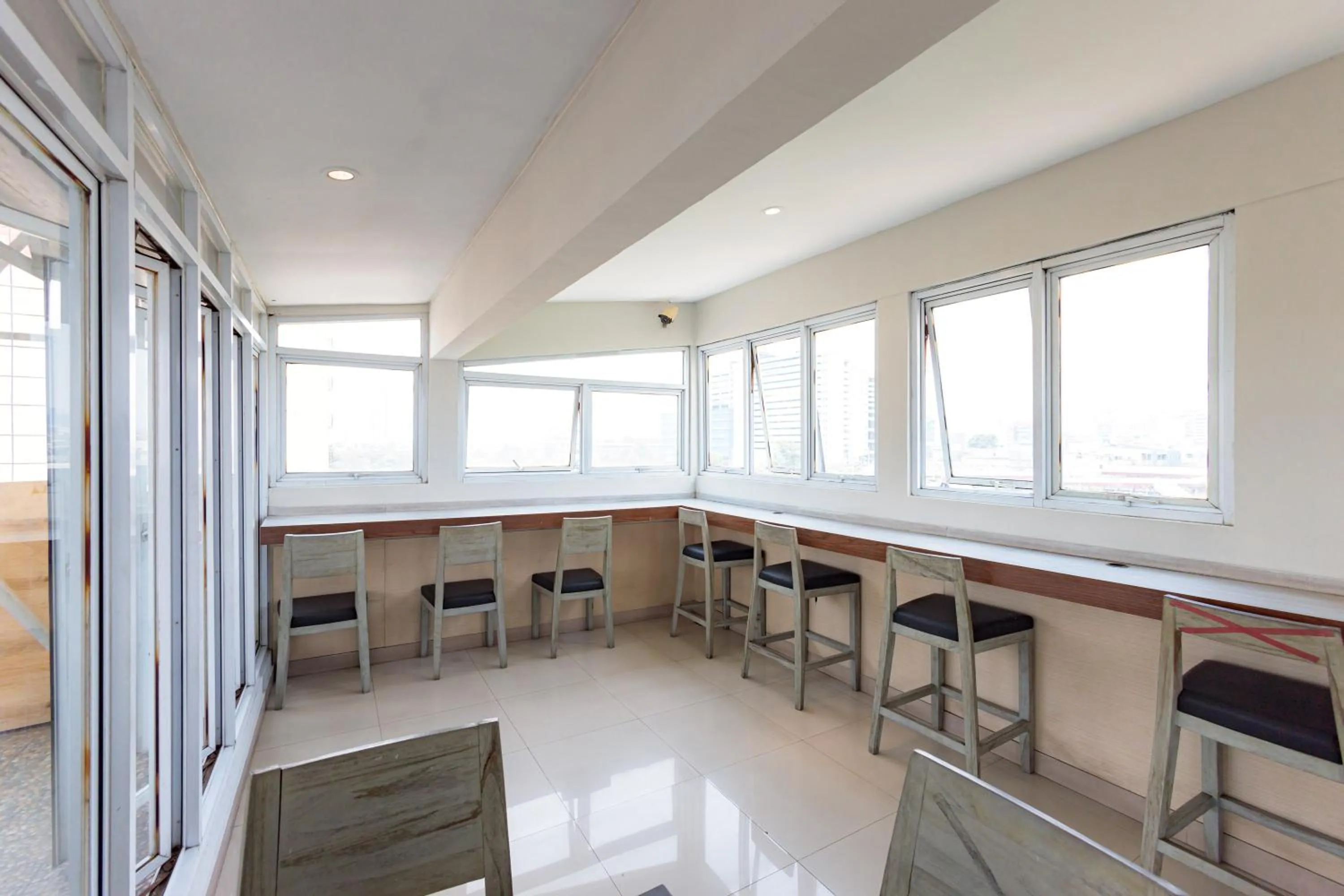 Seating area in Sans Hotel Liv Ancol by RedDoorz