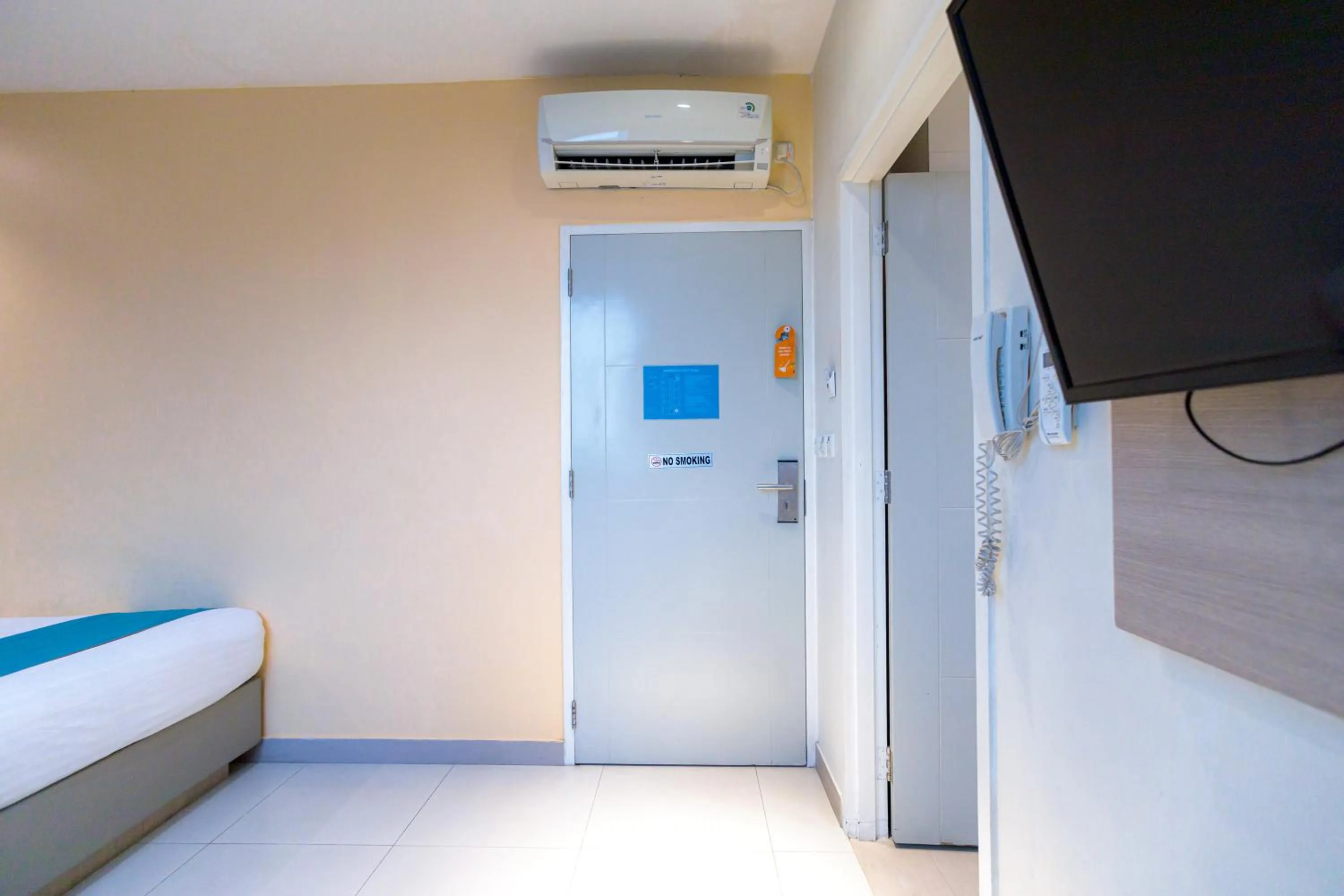 Bedroom, Bed in Sans Hotel Liv Ancol by RedDoorz