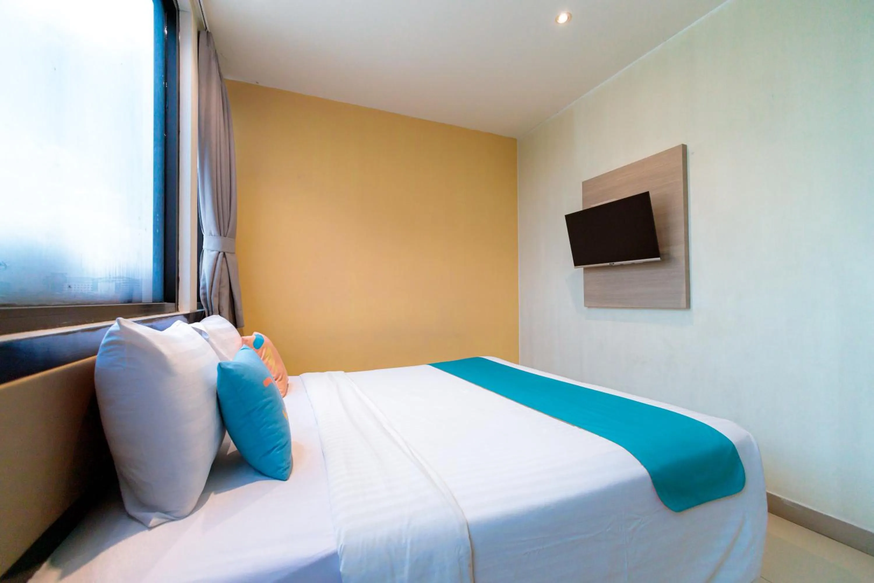 Bedroom, Bed in Sans Hotel Liv Ancol by RedDoorz