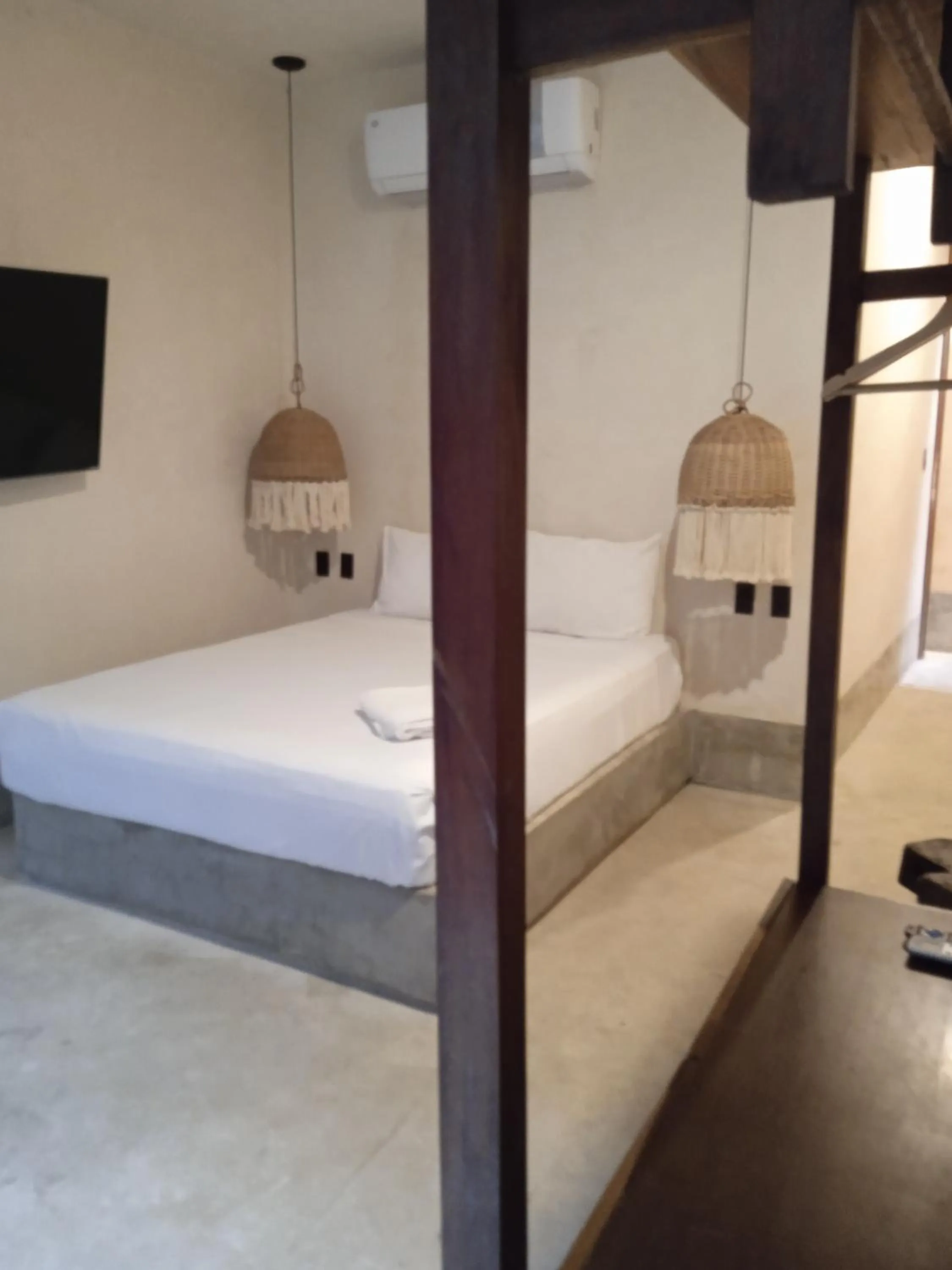 Bed in Nuee Hotel & Beach Club