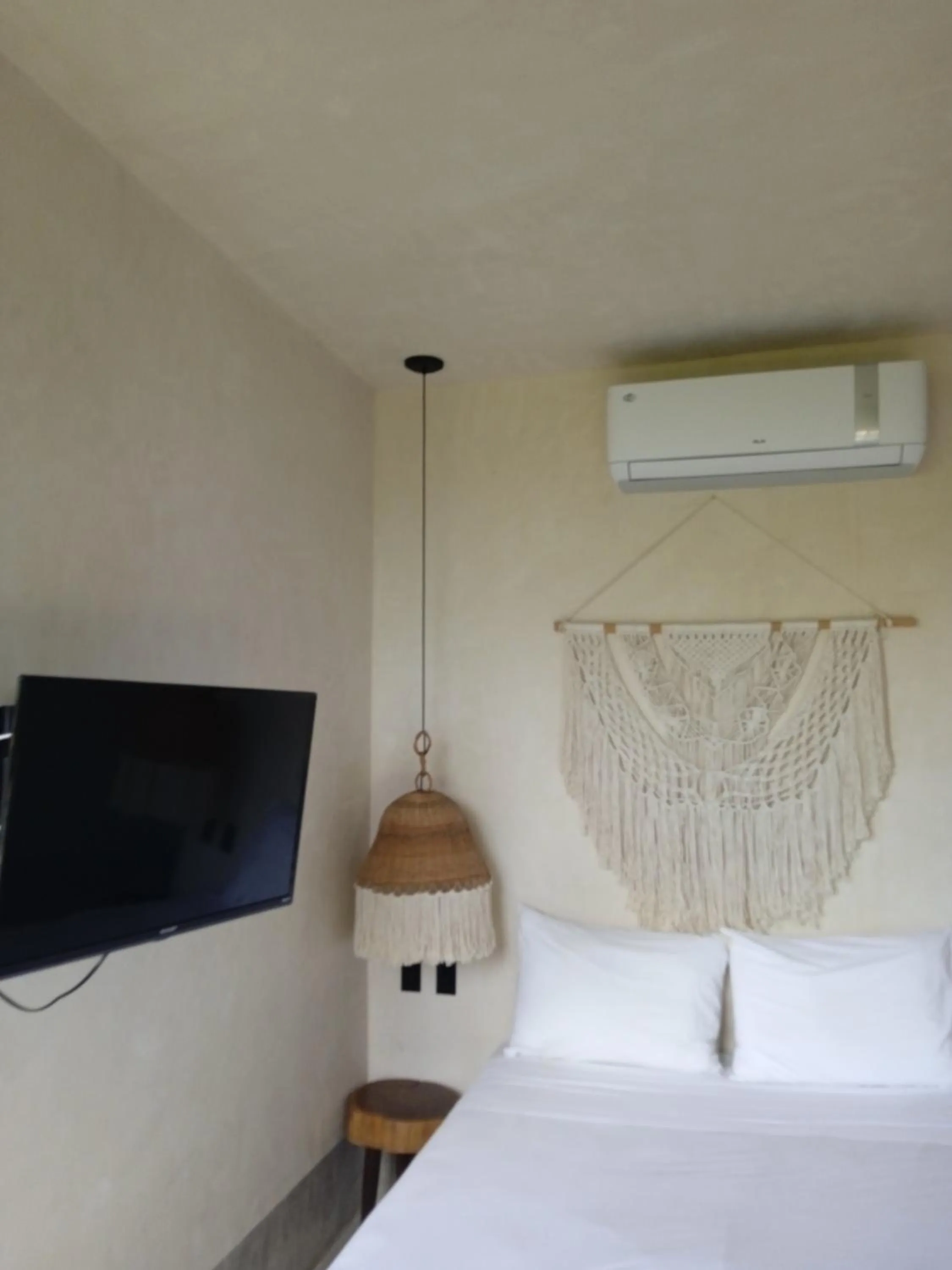 Bed in Nuee Hotel & Beach Club