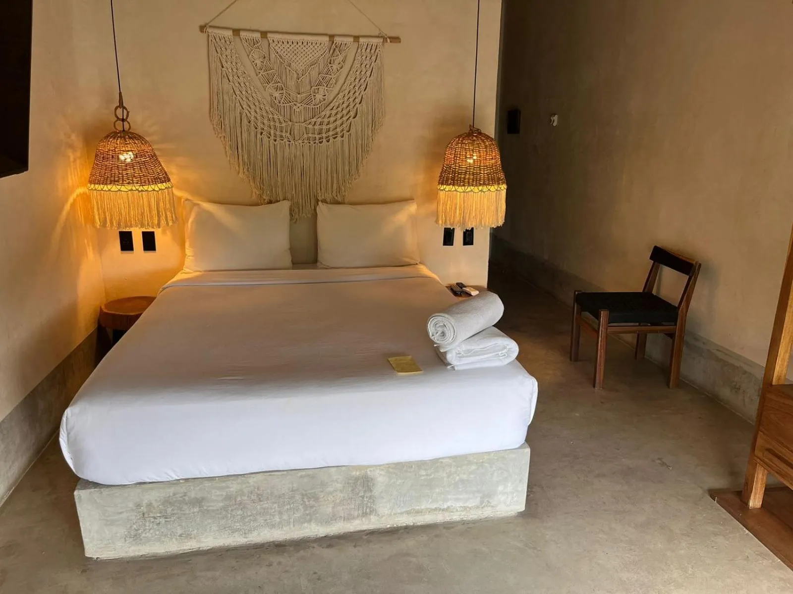 Bed in Nuee Hotel & Beach Club