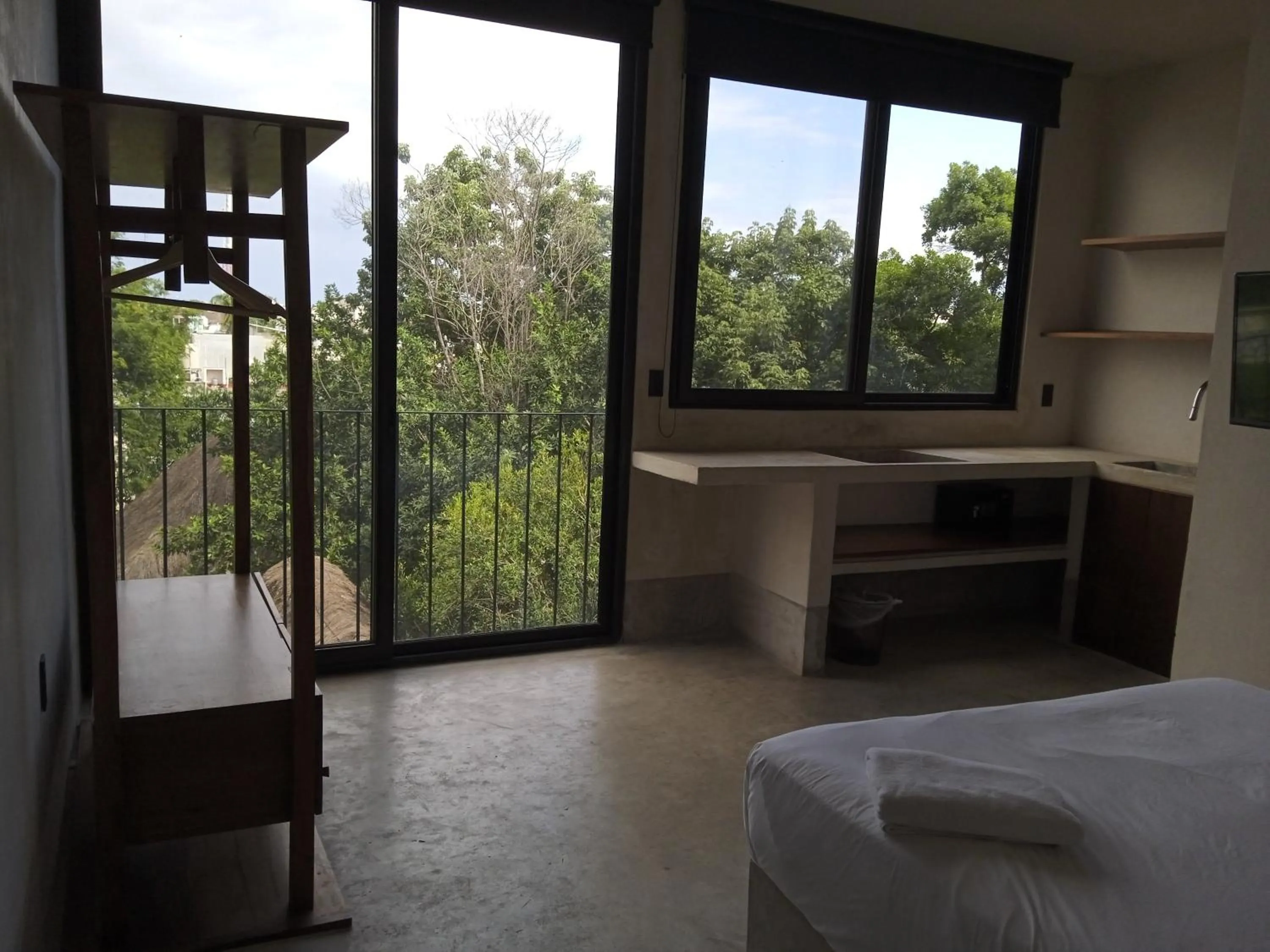 Photo of the whole room, Bed in Nuee Hotel & Beach Club